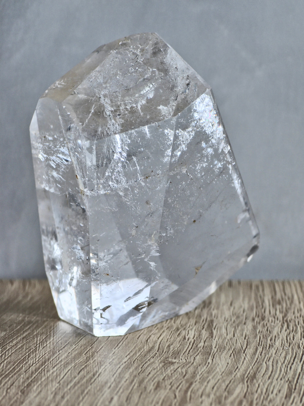 Quartz freeform with iron inclusions and rainbow
