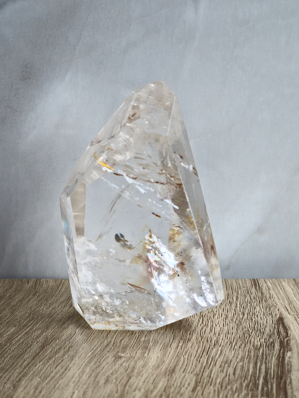 Quartz freeform with iron inclusions and rainbows