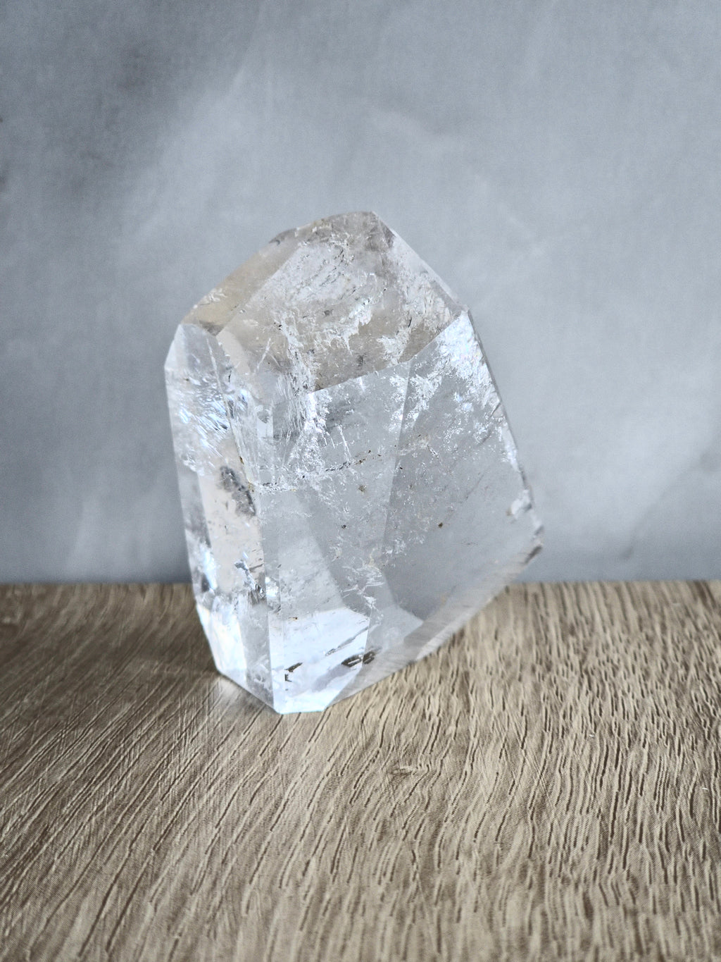 Quartz freeform with iron inclusions and rainbow