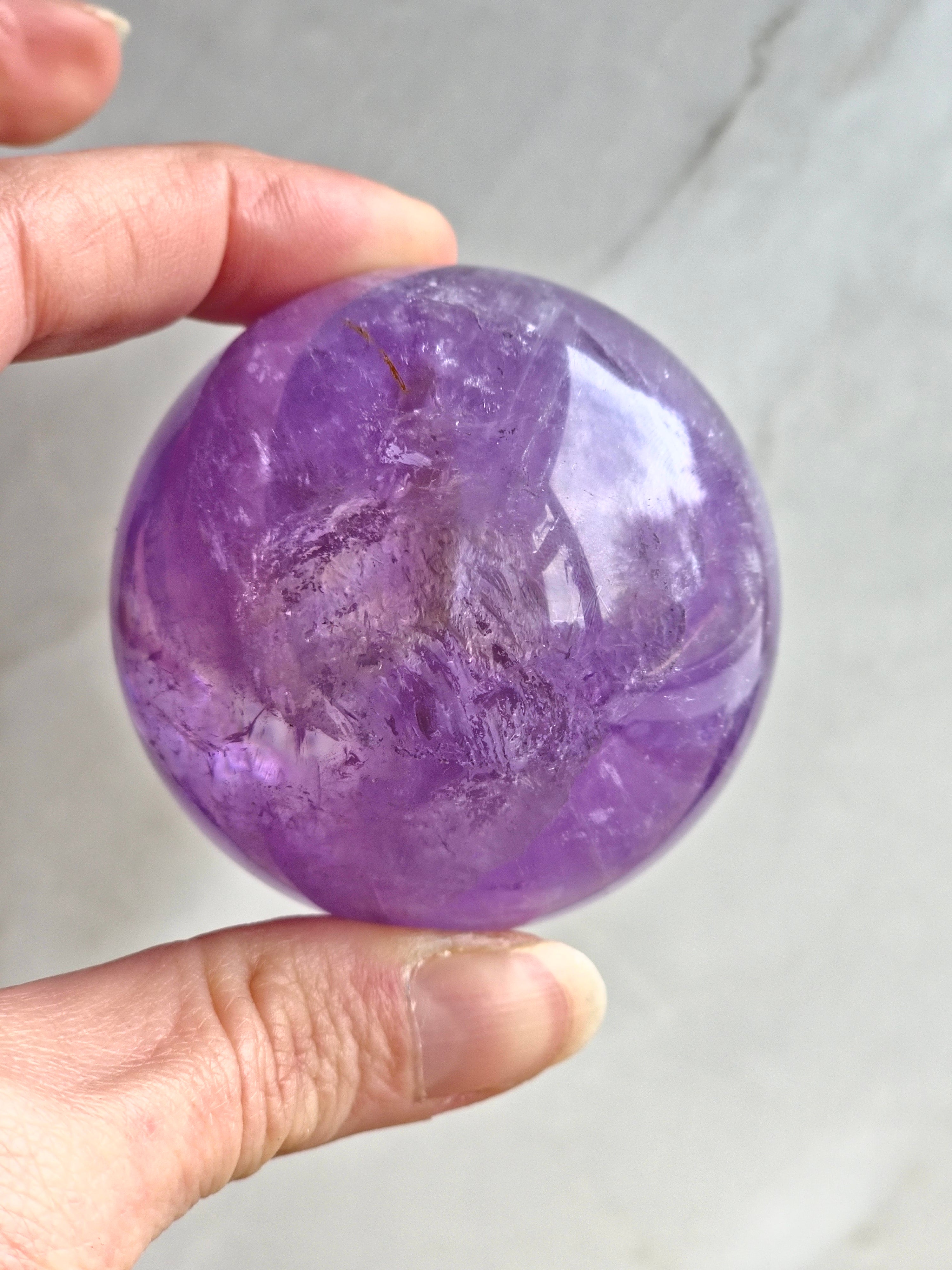 Amethyst sphere with phantom lines and rainbows