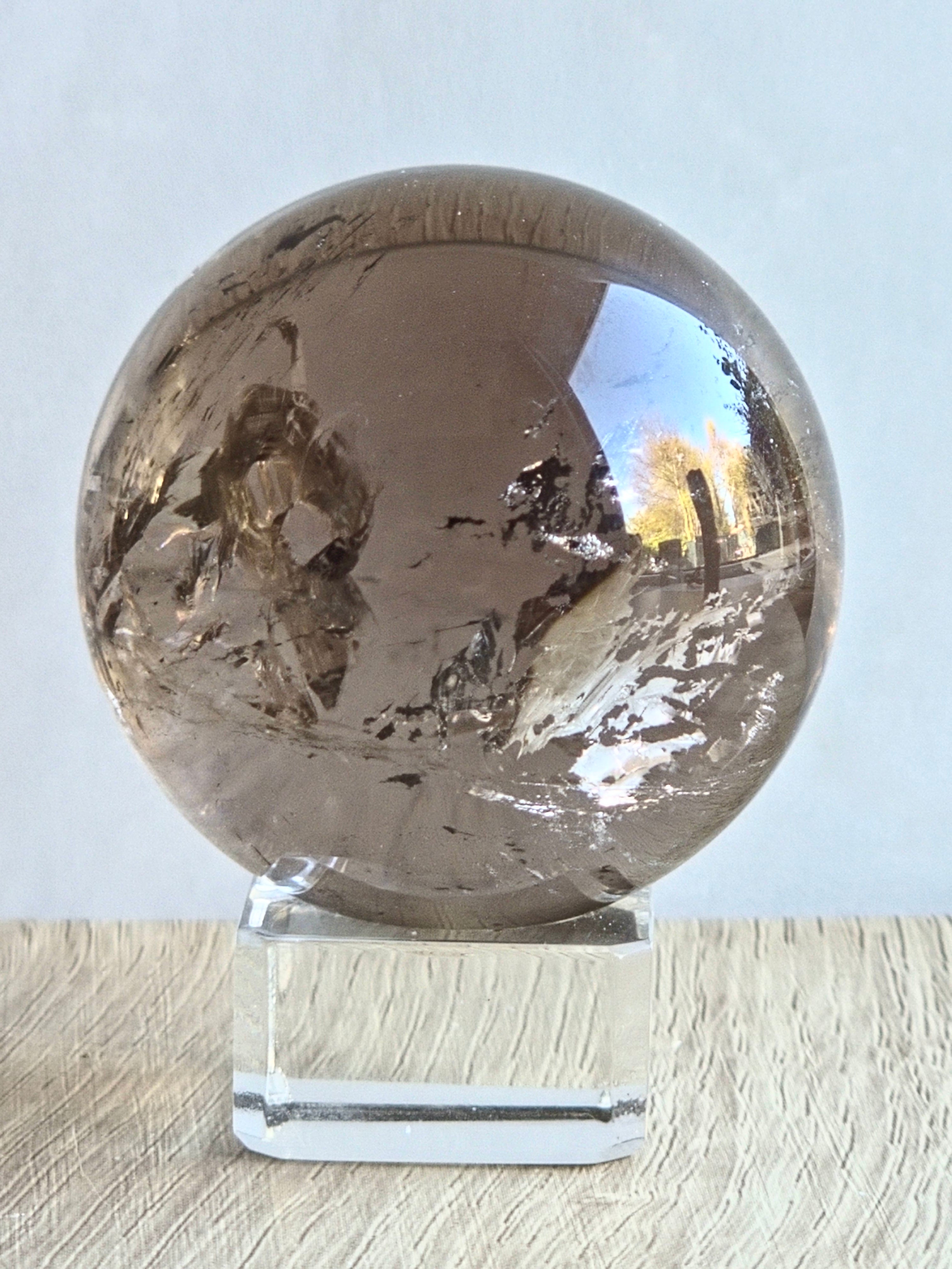 Smoky quartz sphere with rainbows - c