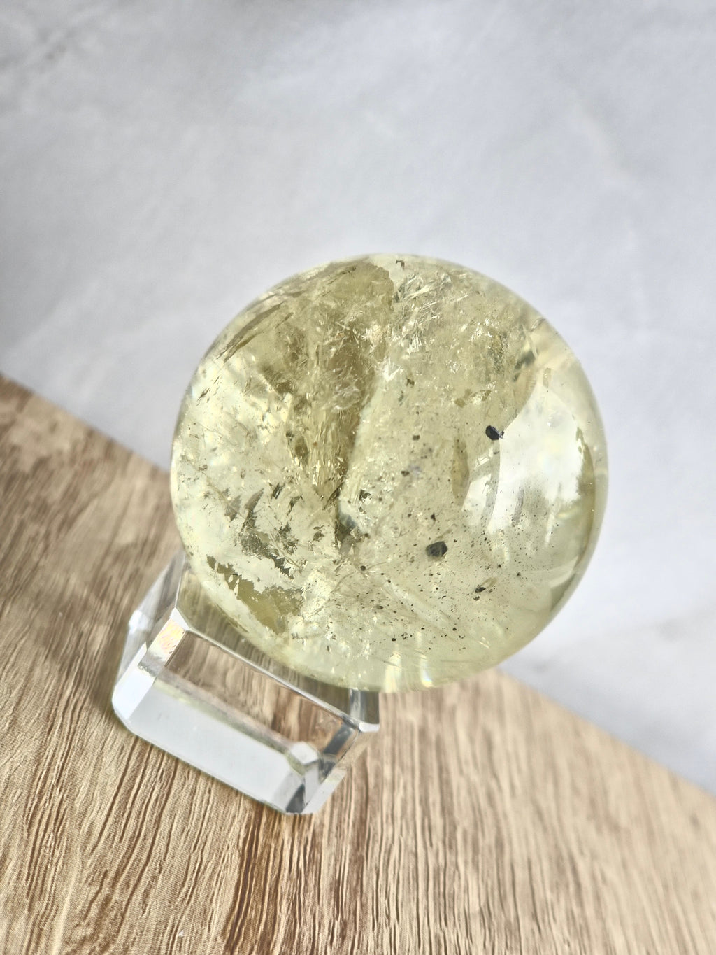 Citrine sphere with tourmaline inclusions