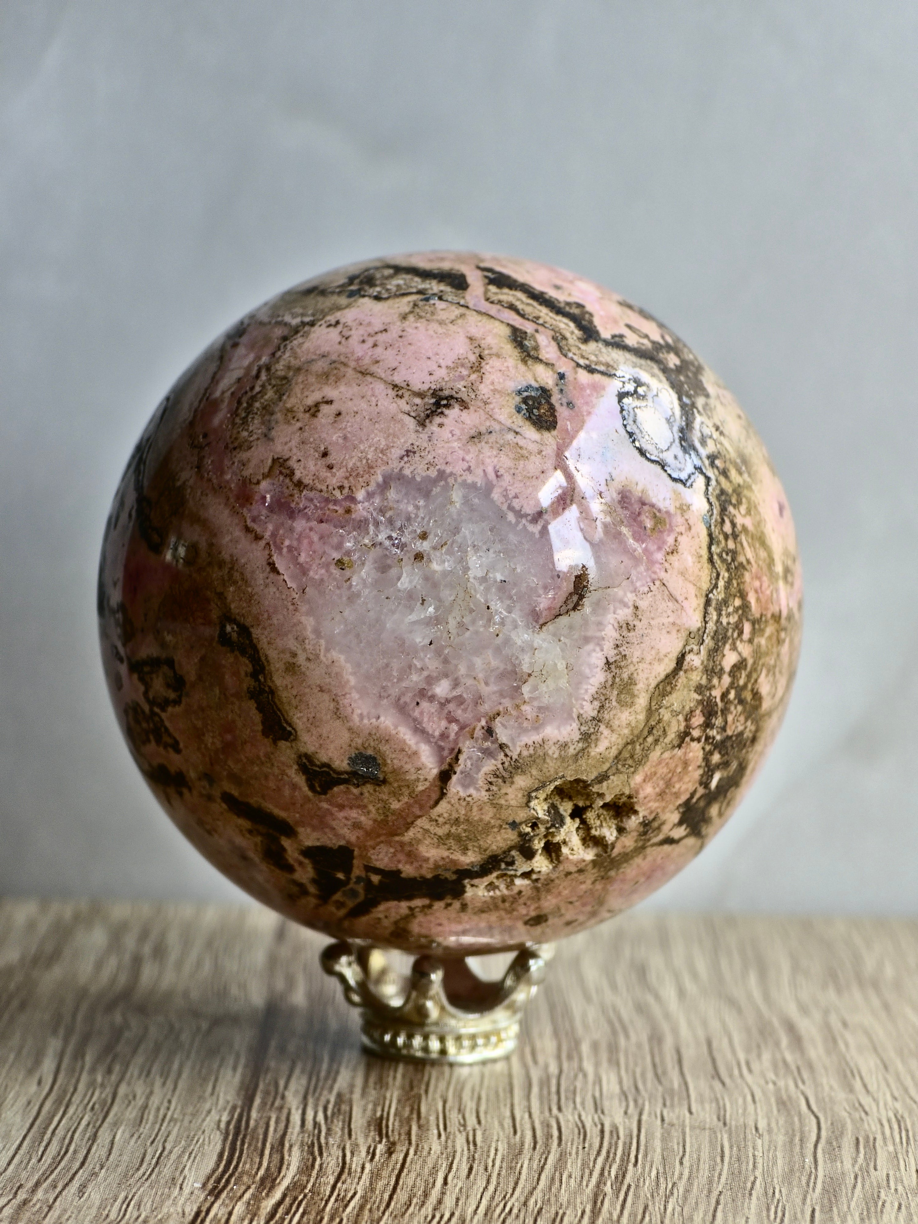 Peruvian Rhodonite Sphere — Pink Manganese Silicate with Quartz Pocket + Manganese Oxide Veining
