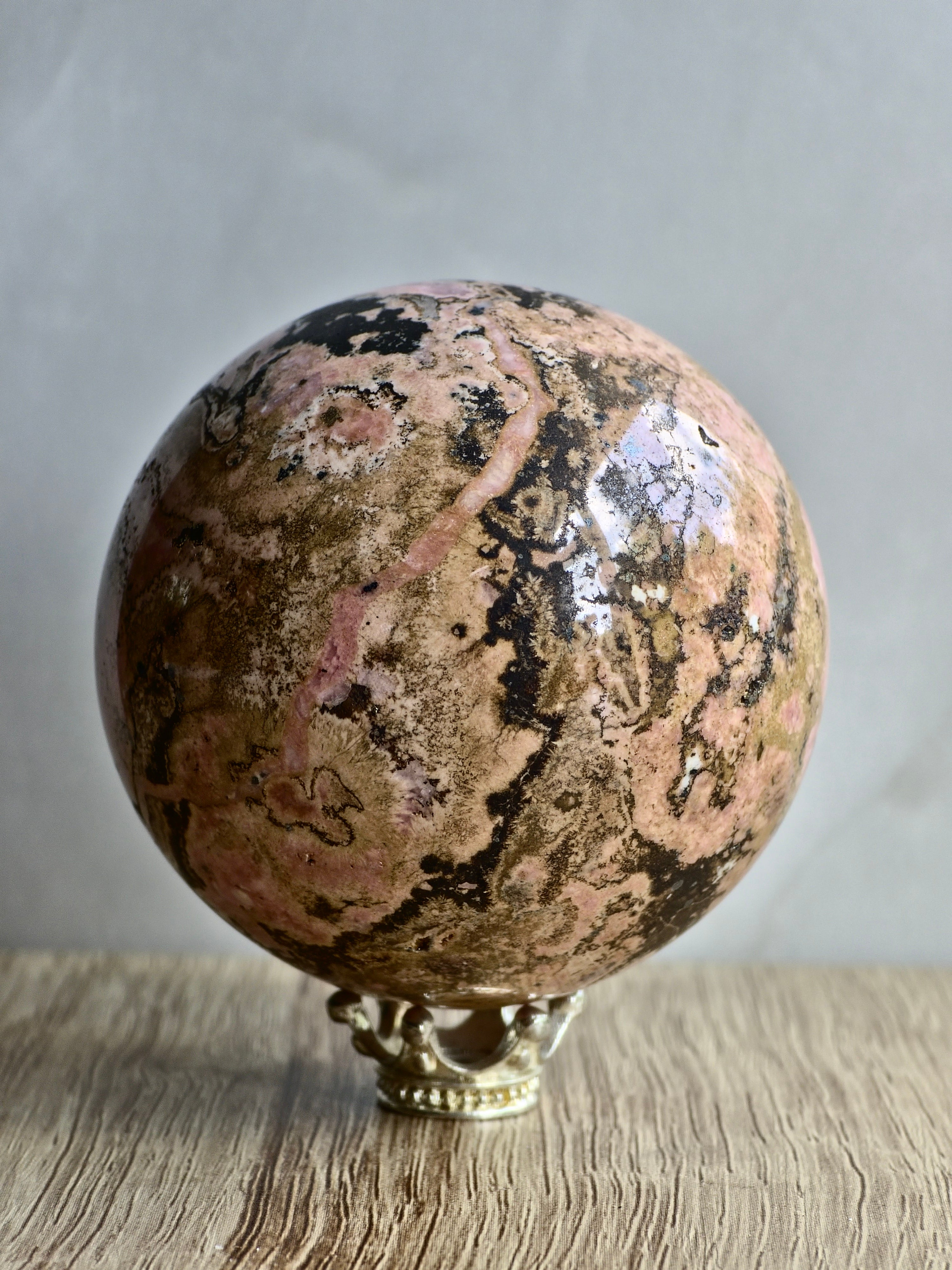 Peruvian Rhodonite Sphere — Pink Manganese Silicate with Quartz Pocket + Manganese Oxide Veining