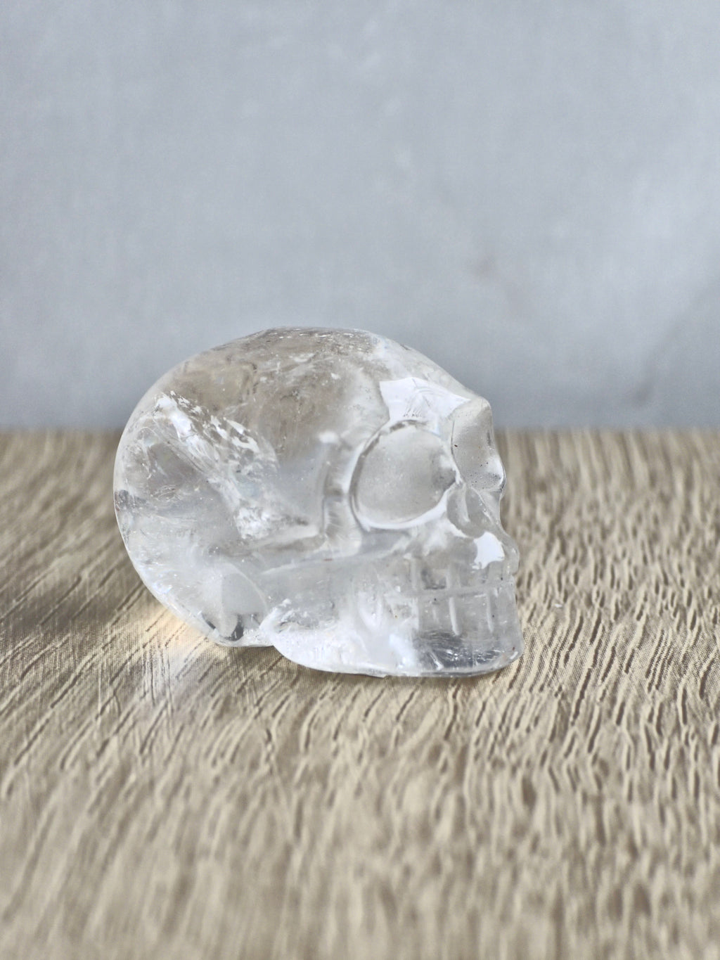 Clear quartz skull with rainbow - c