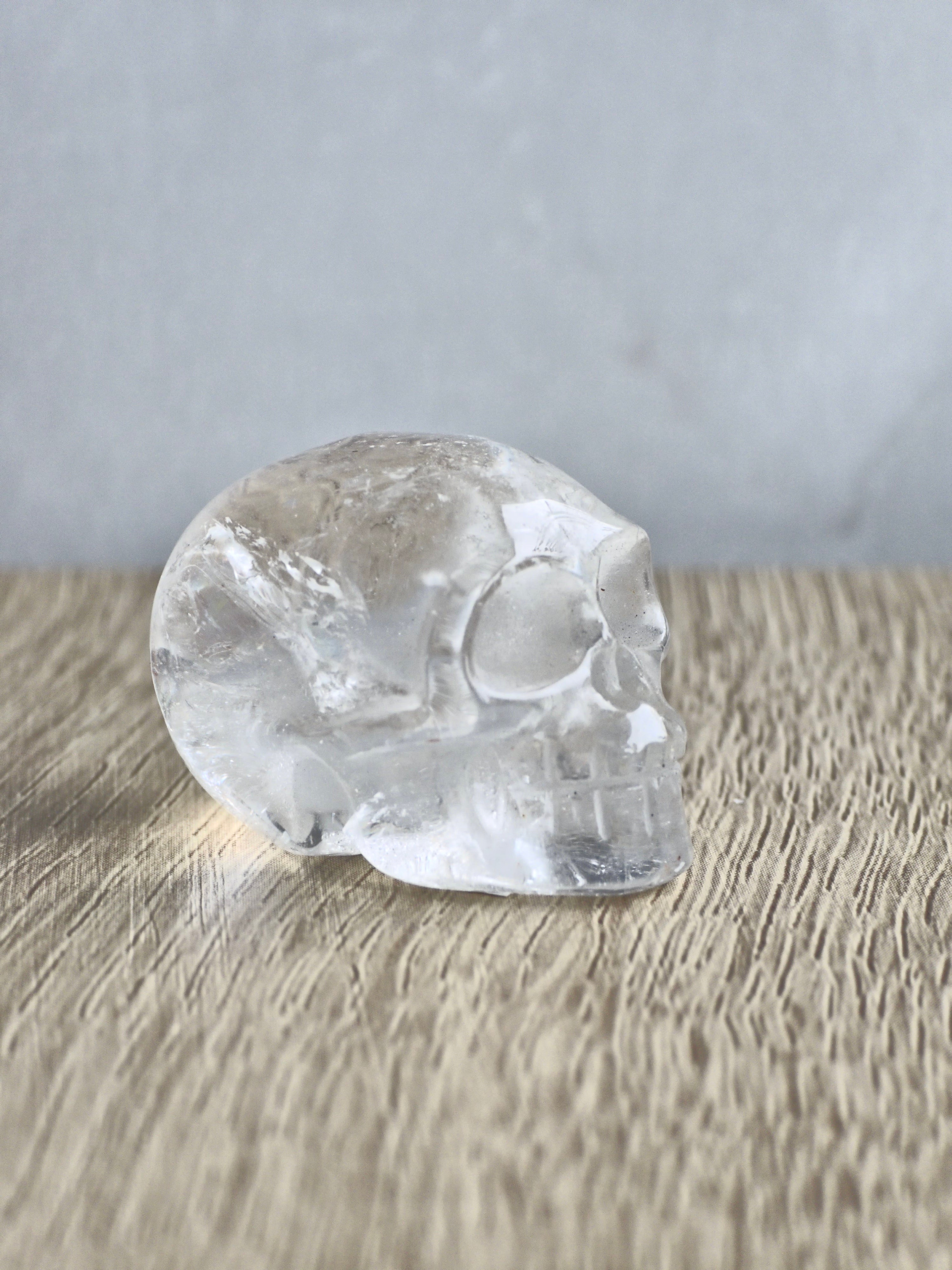 Clear quartz skull with rainbow - c