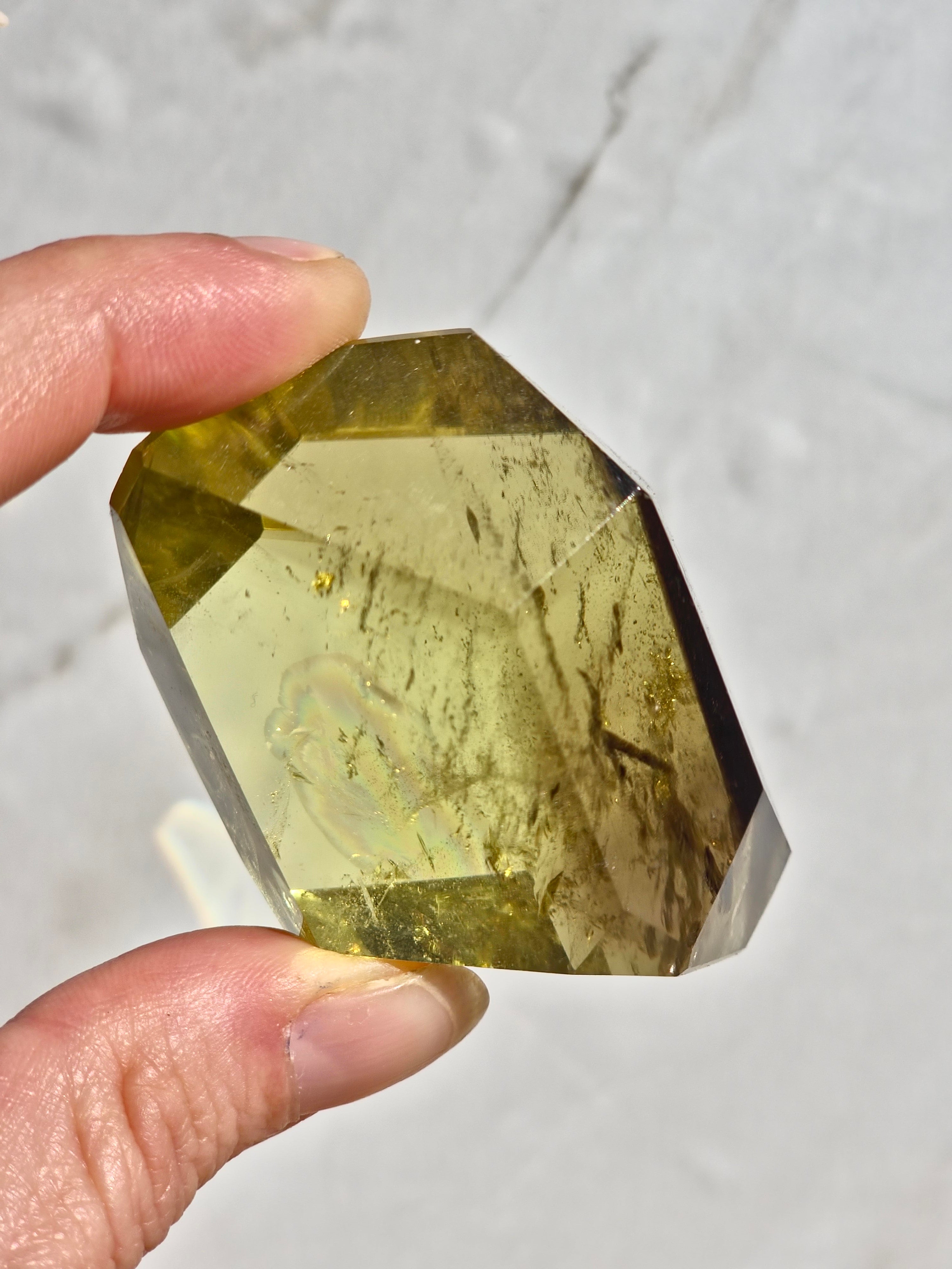 Natural citrine (smoky zoning) with phantom inclusions and rainbow fractures