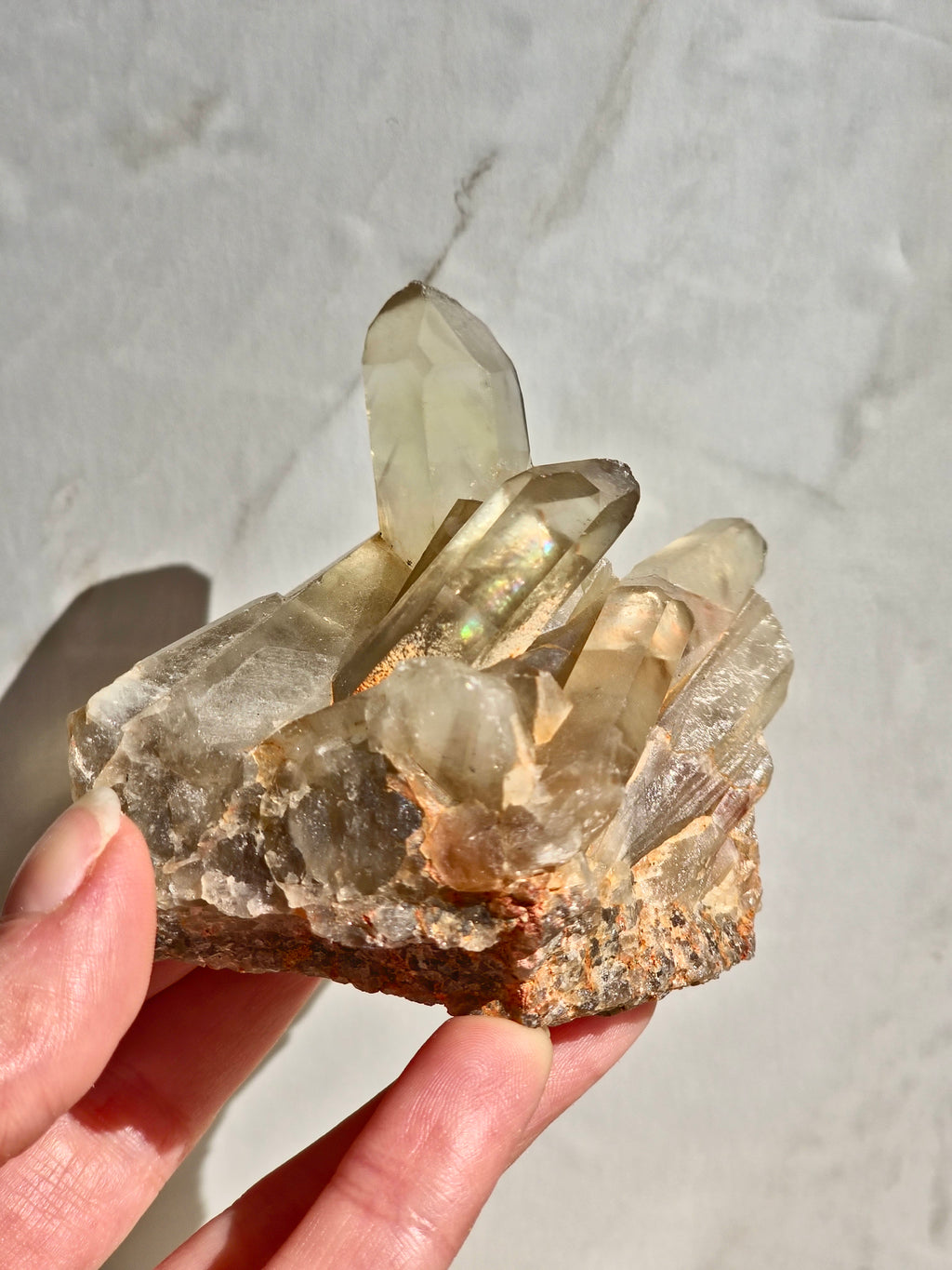 Natural citrine cluster with rainbow inclusion