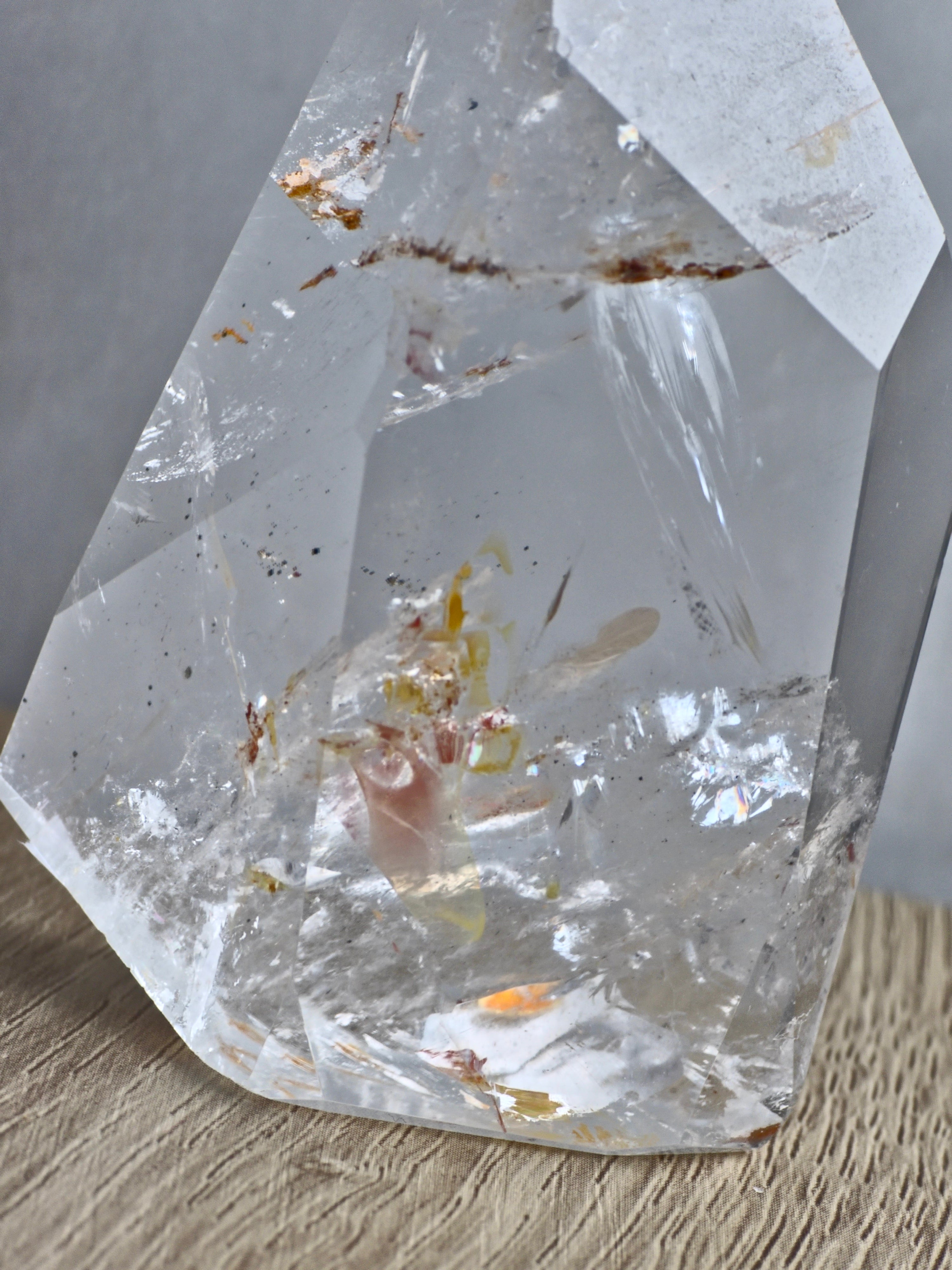 Quartz freeform with iron inclusions and rainbows