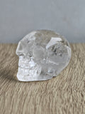 Clear quartz skull with rainbows - b