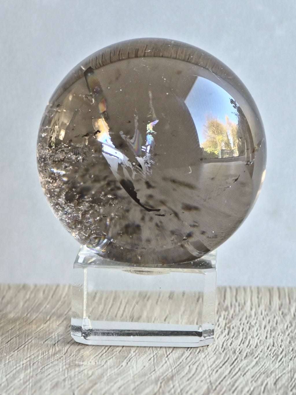 Smokey quartz sphere with rainbows - f