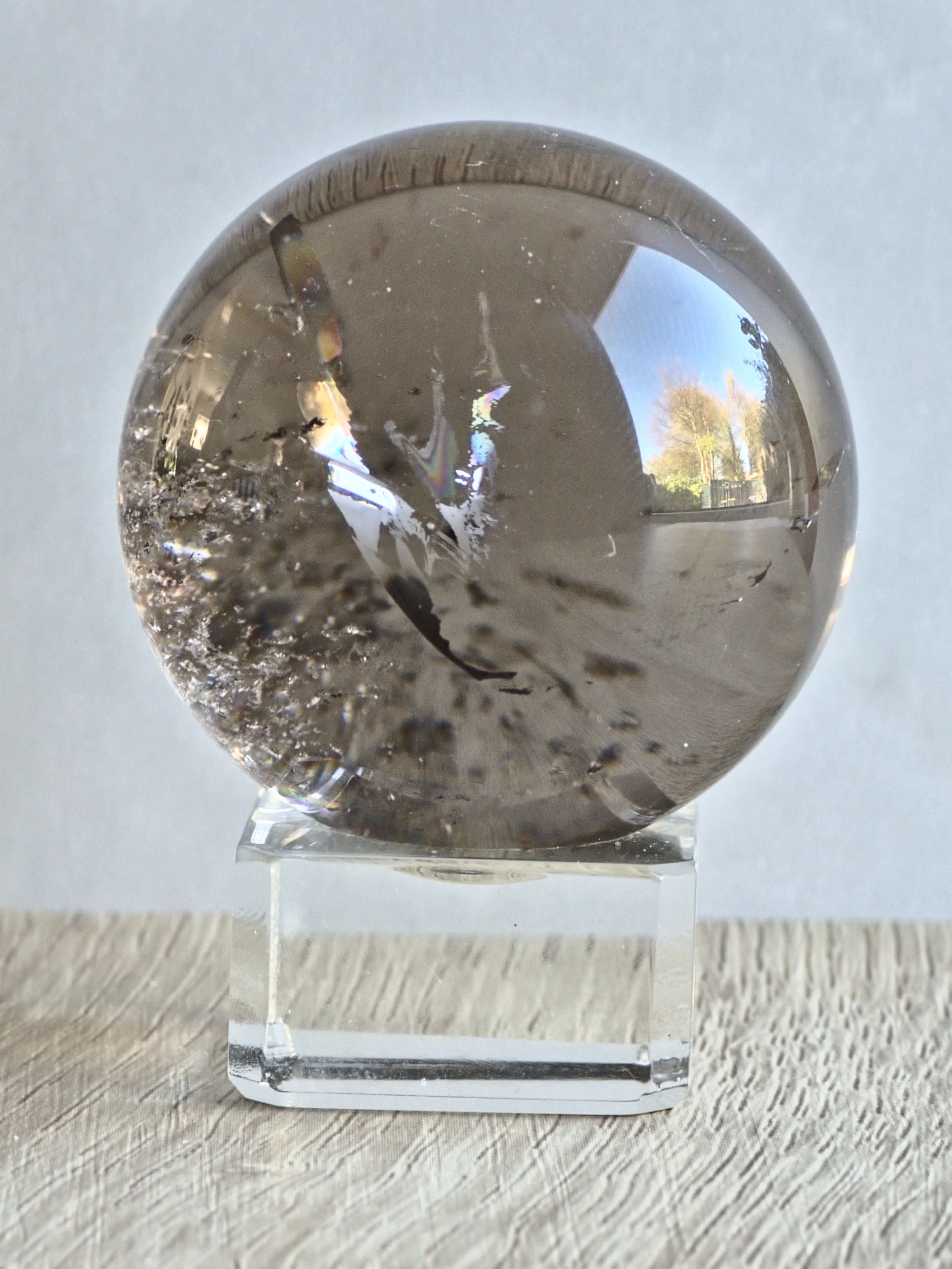 Smokey quartz sphere with rainbows - f