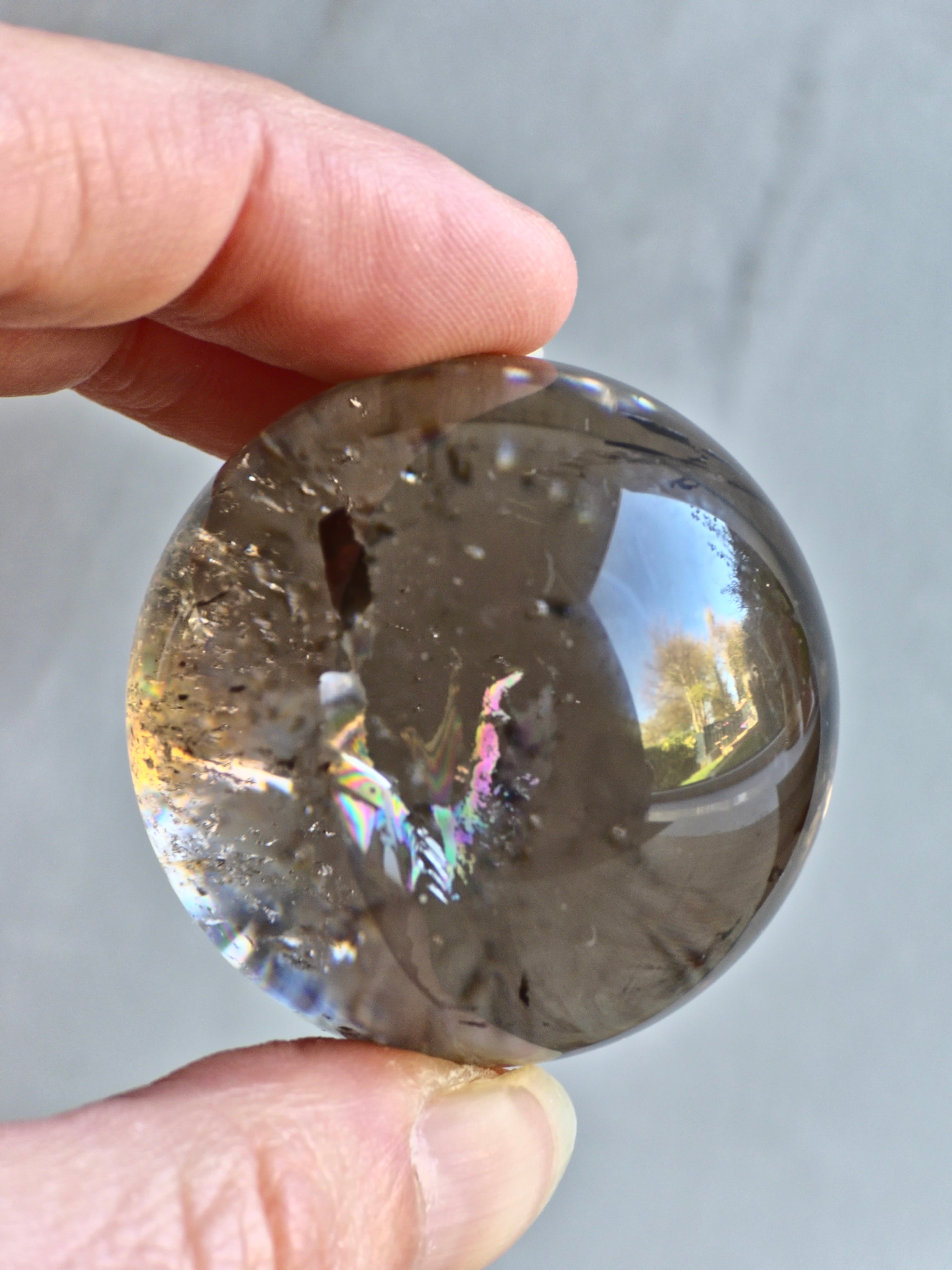 Smokey quartz sphere with rainbows - f