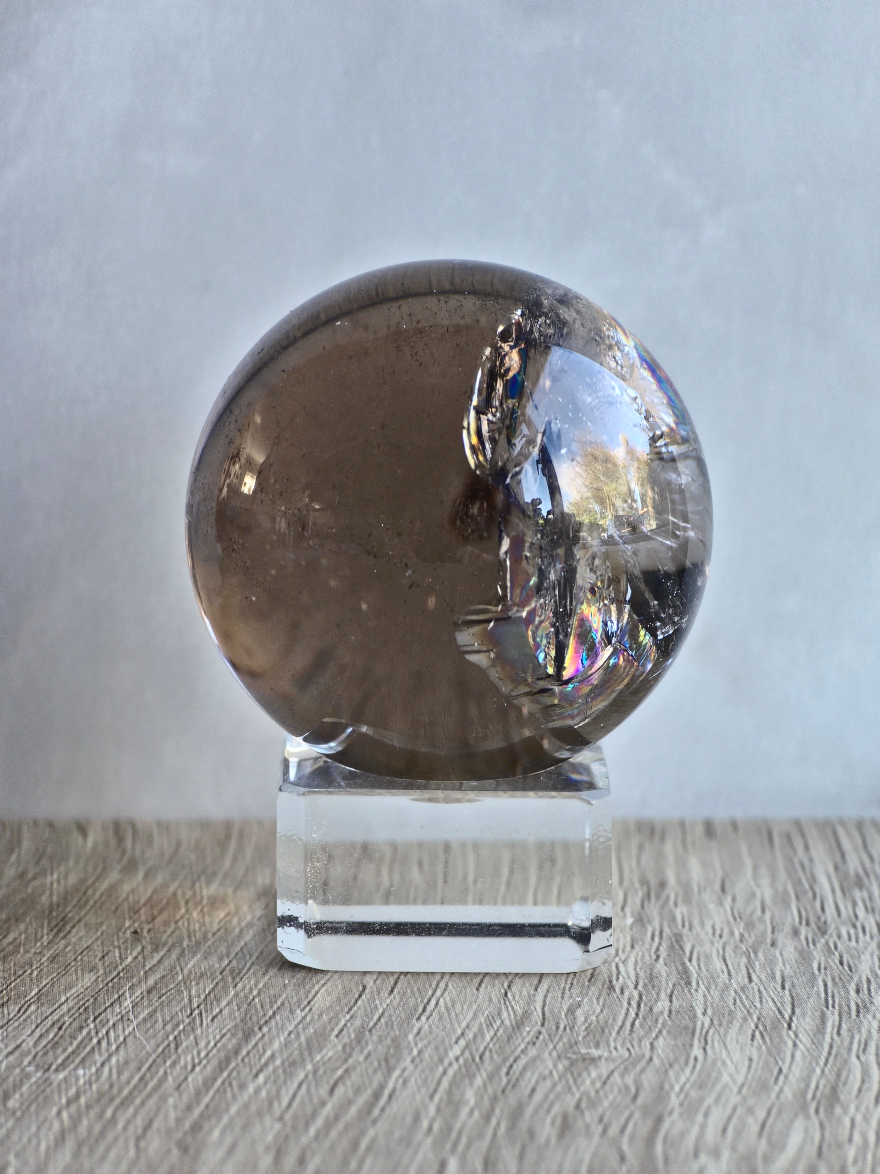 Smokey quartz sphere with rainbows- a