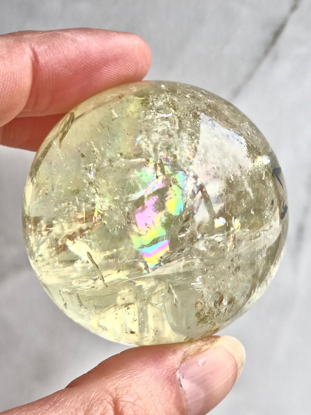 Citrine sphere with tourmaline inclusions