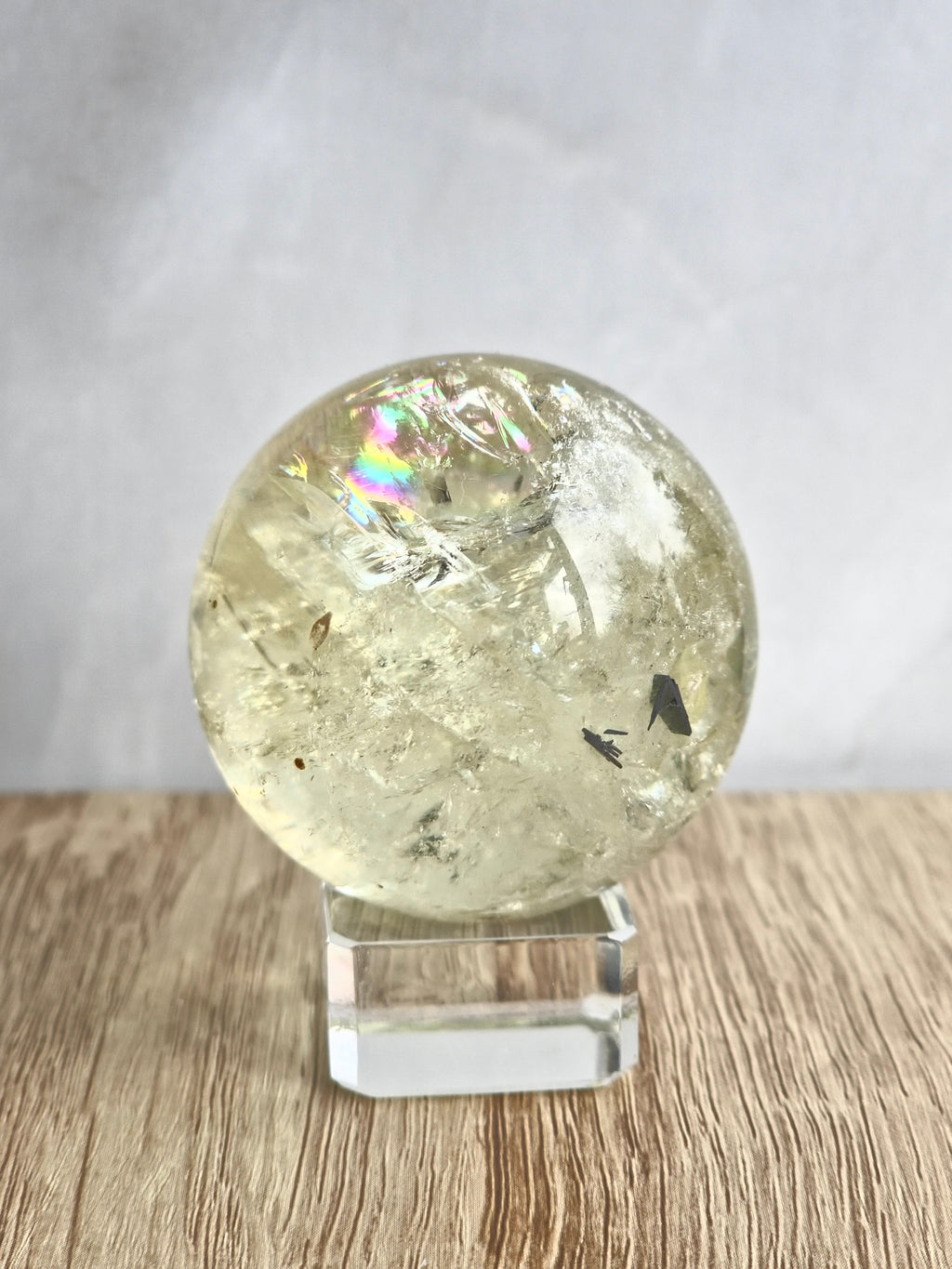 Citrine sphere with tourmaline inclusions
