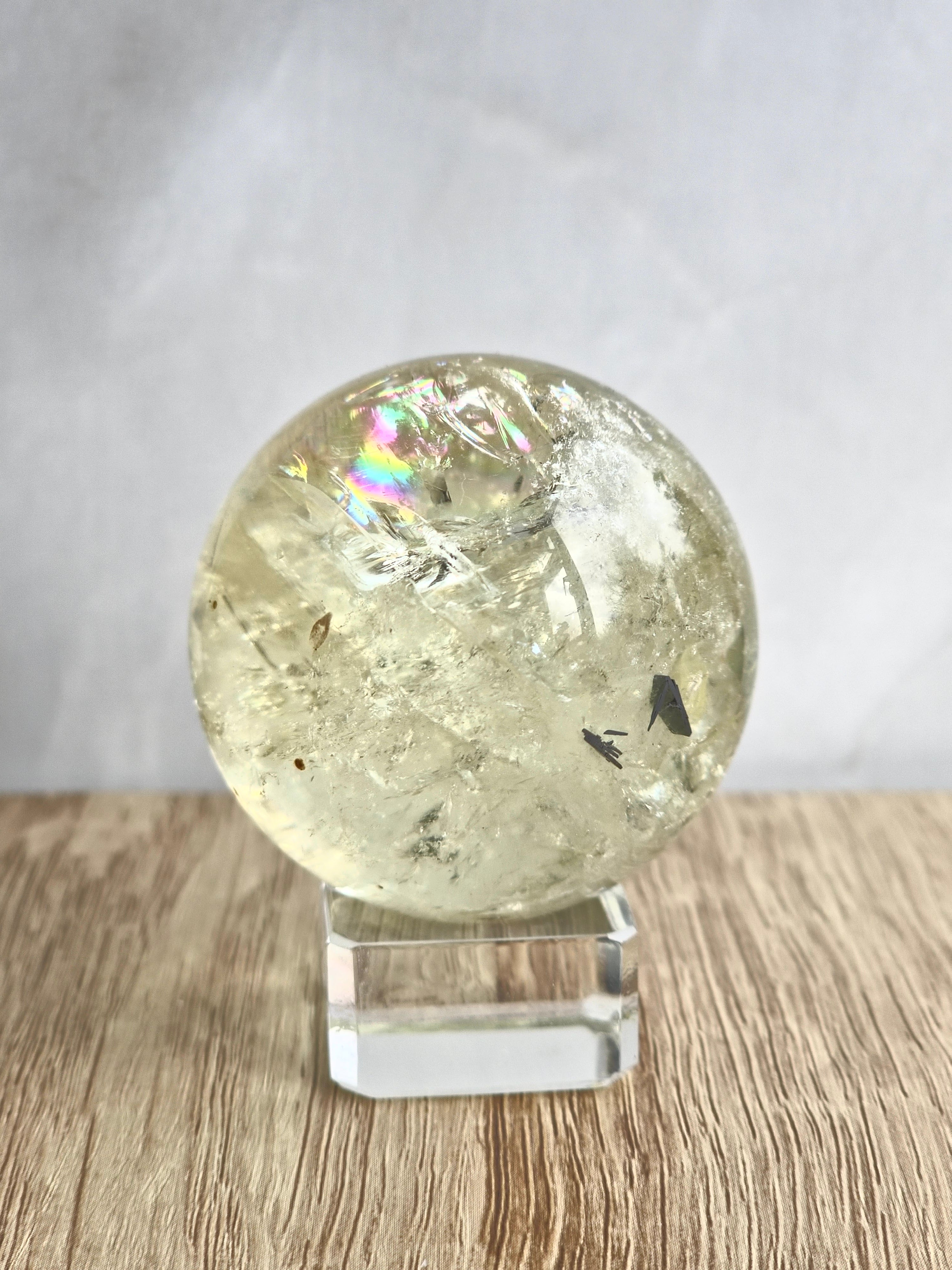 Citrine sphere with tourmaline inclusions
