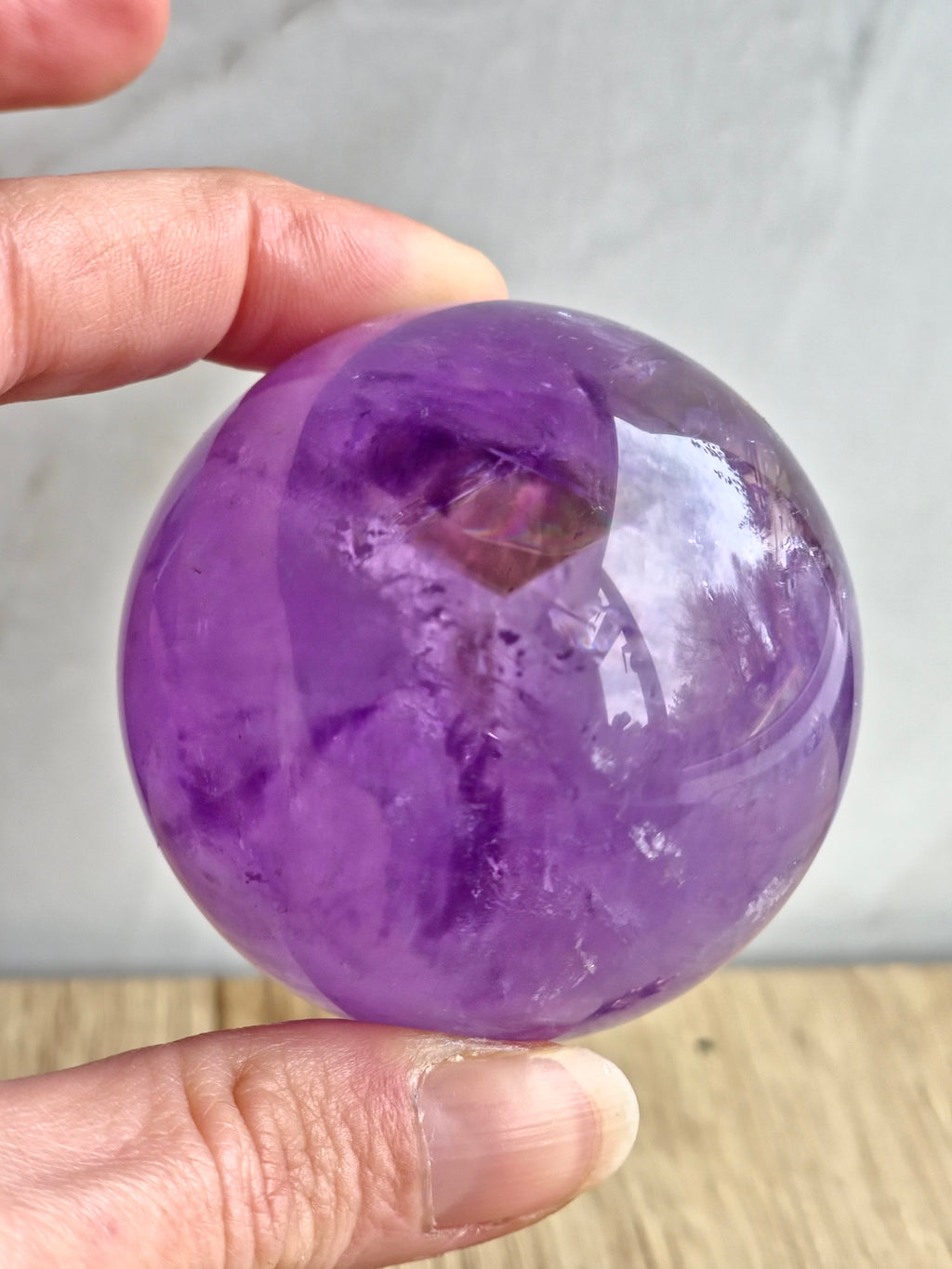 Amethyst sphere with phantom lines and rainbows