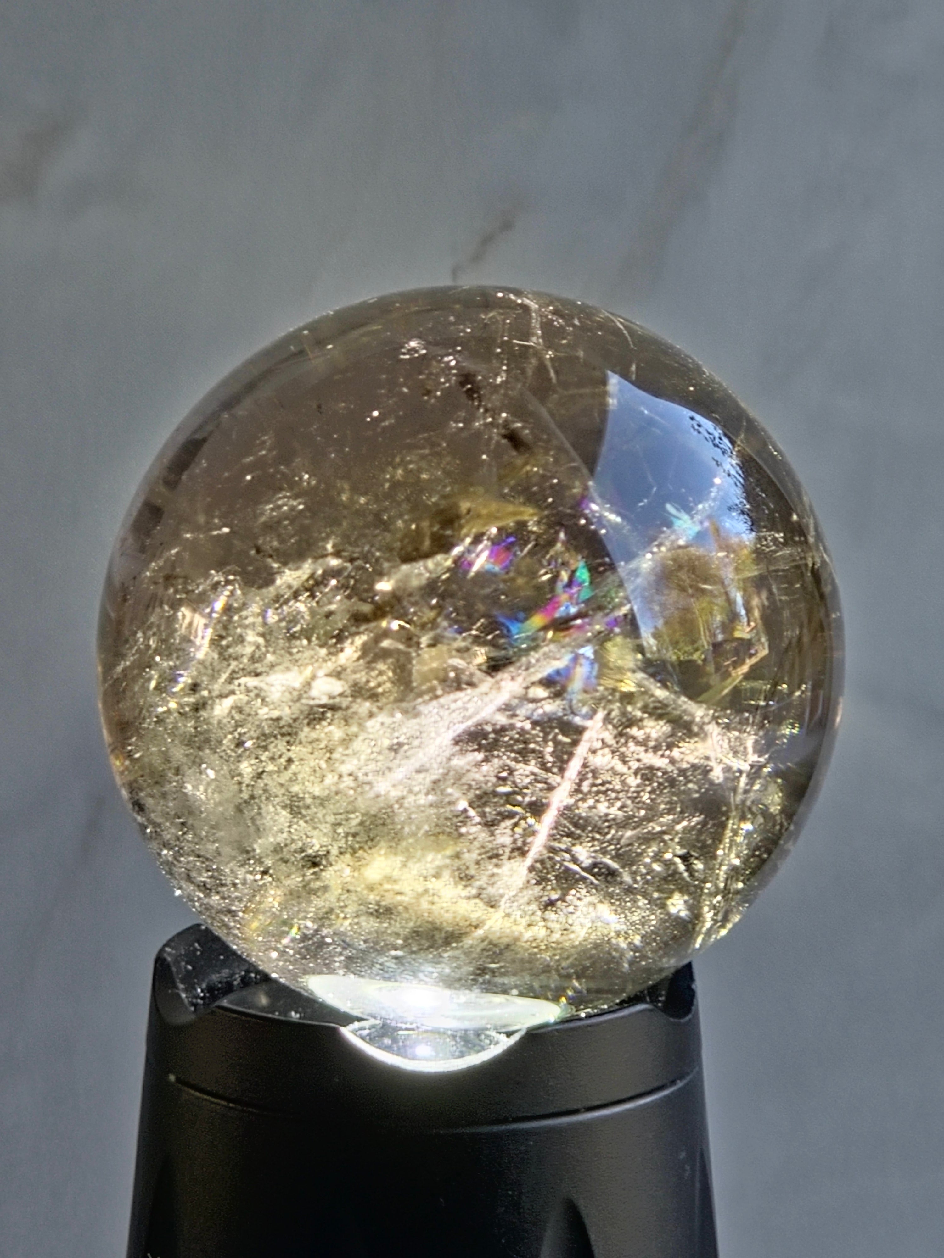 Smoky quartz sphere with rainbows - c
