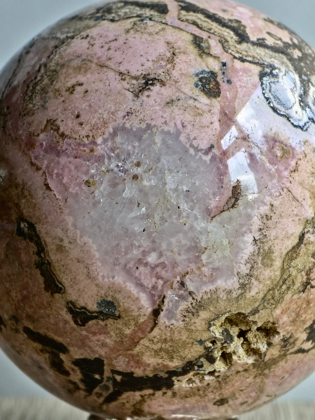 Peruvian Rhodonite Sphere — Pink Manganese Silicate with Quartz Pocket + Manganese Oxide Veining