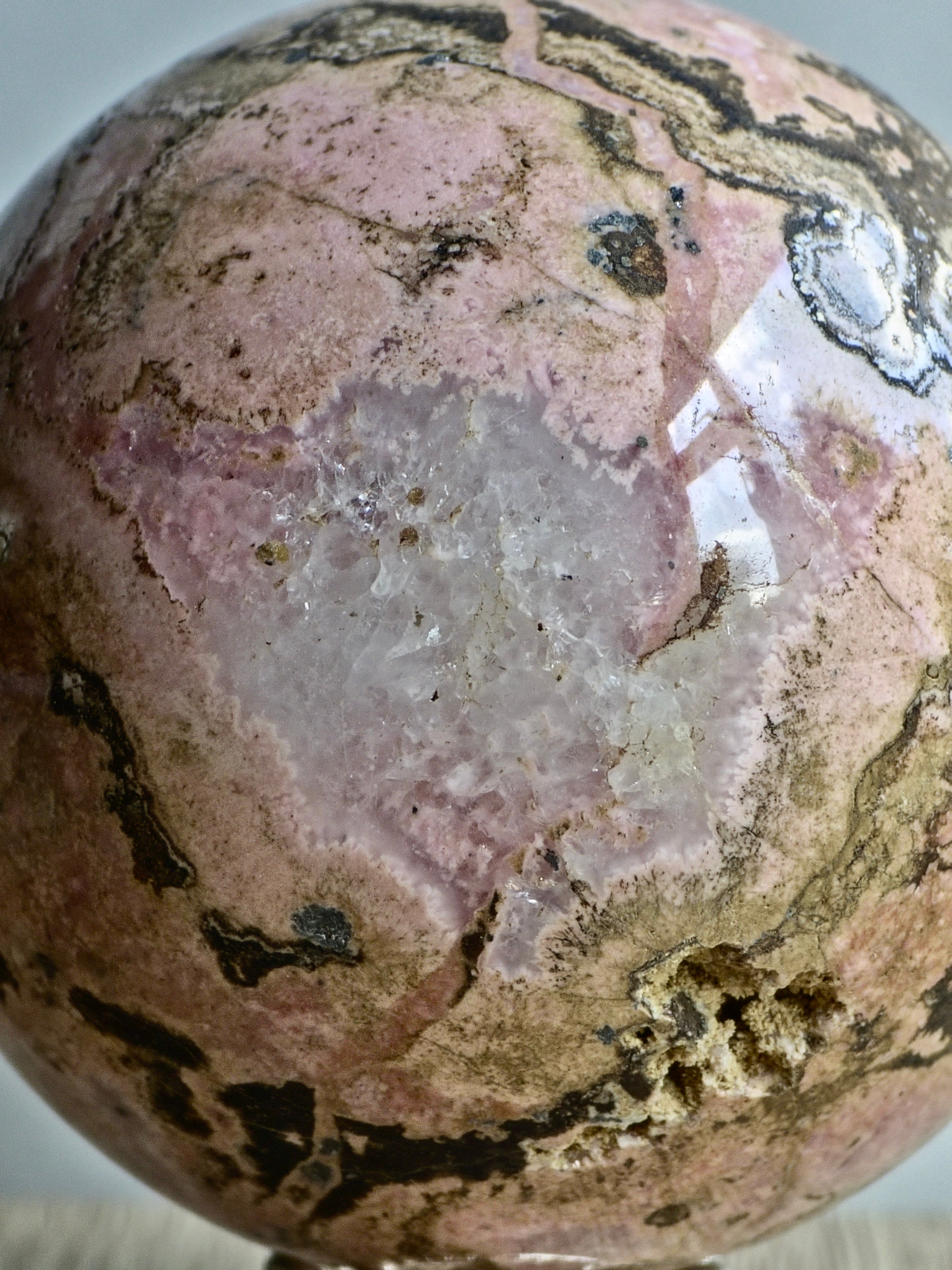 Peruvian Rhodonite Sphere — Pink Manganese Silicate with Quartz Pocket + Manganese Oxide Veining