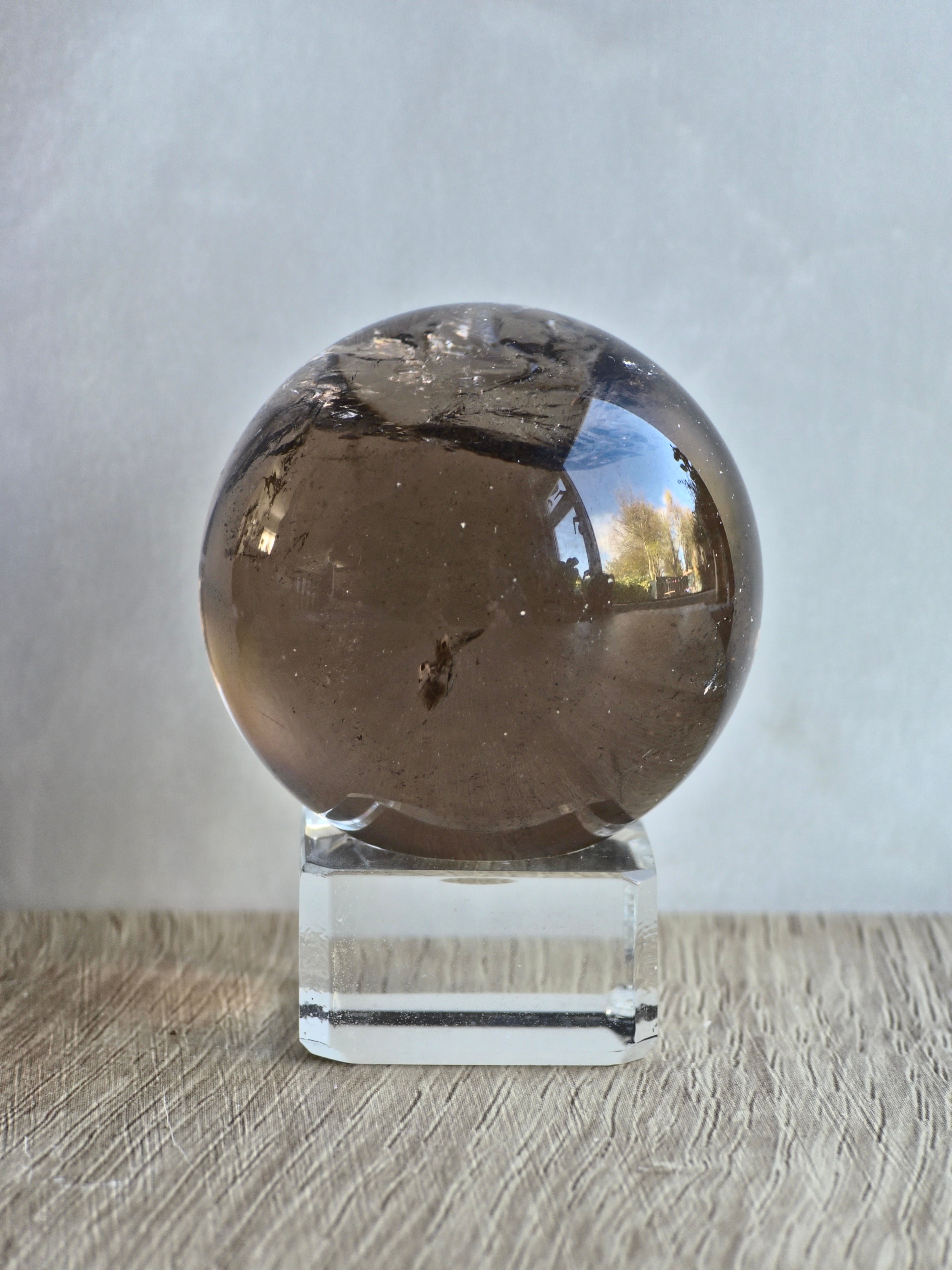 Smokey quartz sphere with rainbows- a