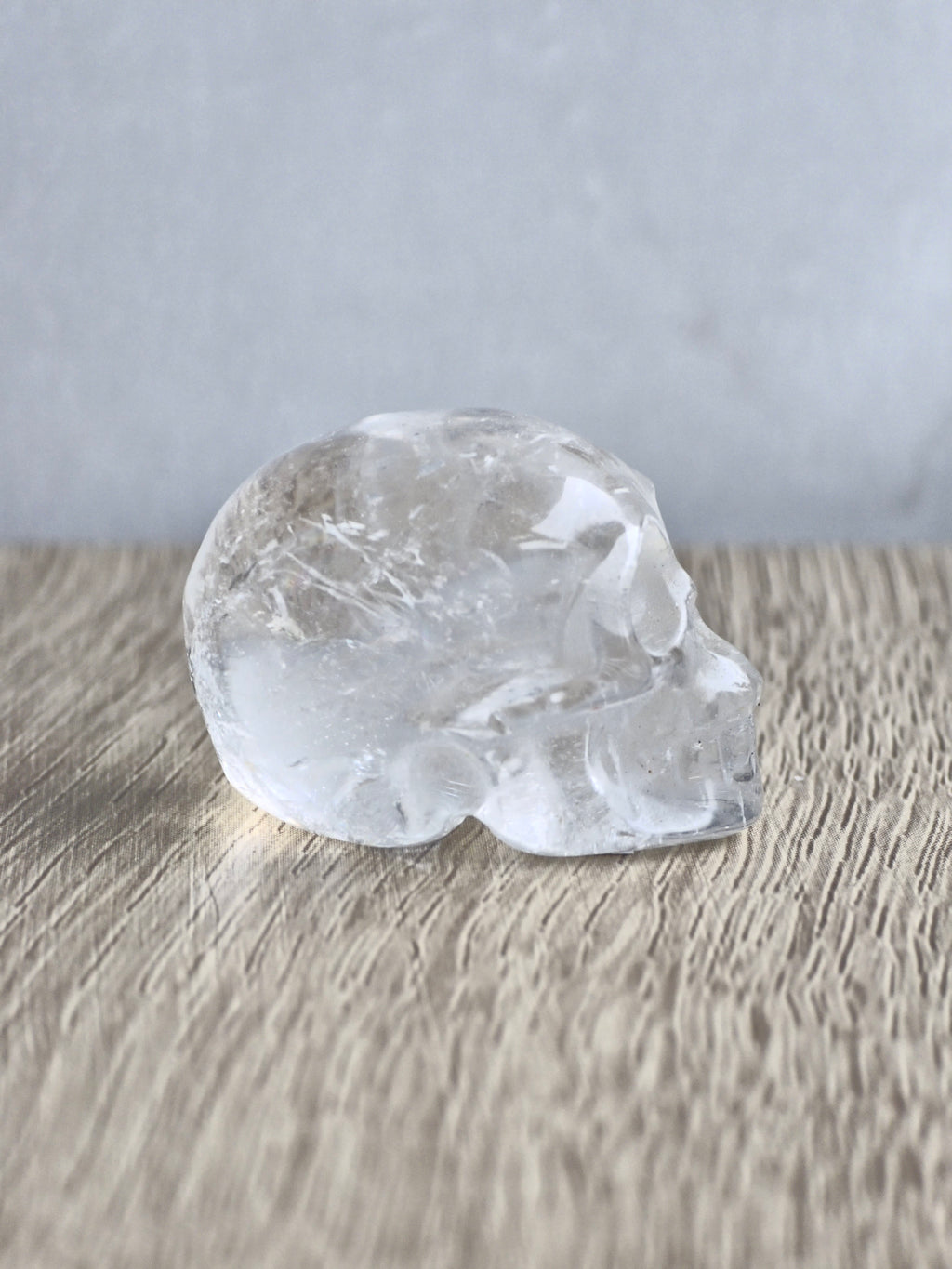 Clear quartz skull with rainbow - c