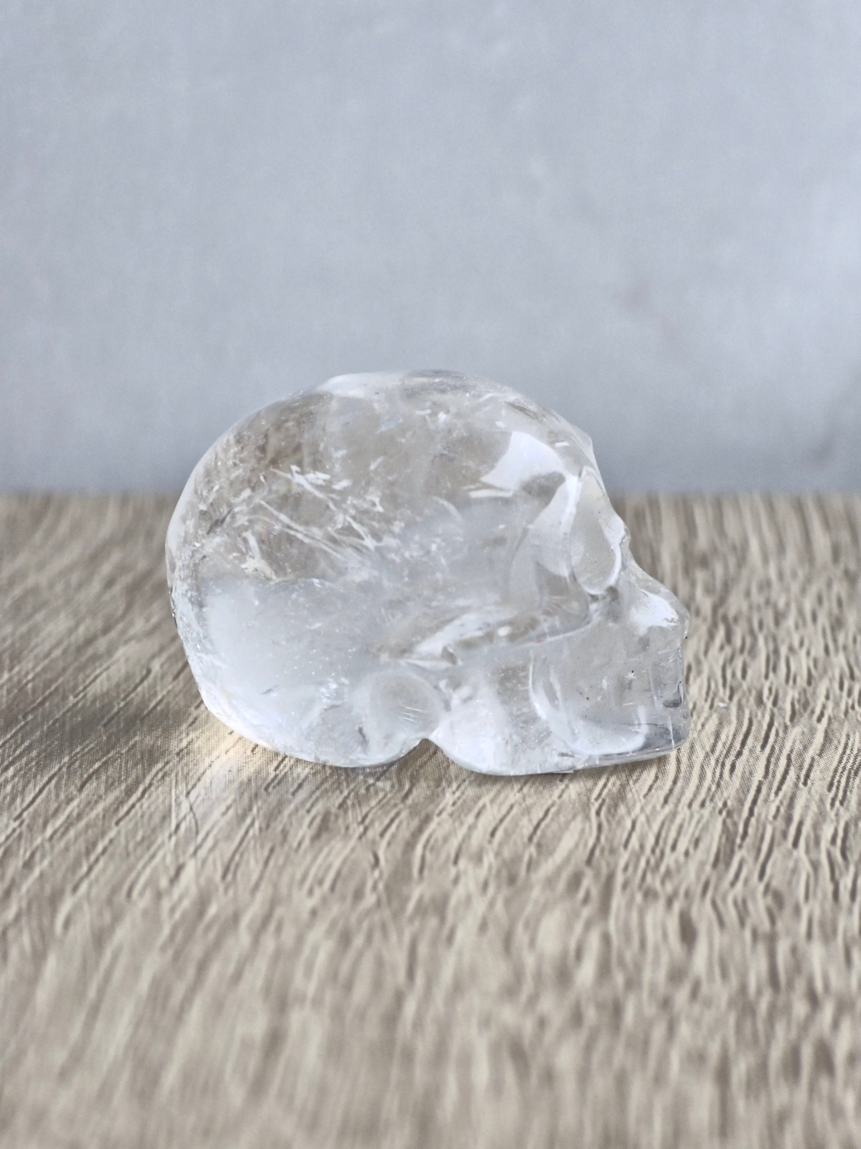 Clear quartz skull with rainbow - c