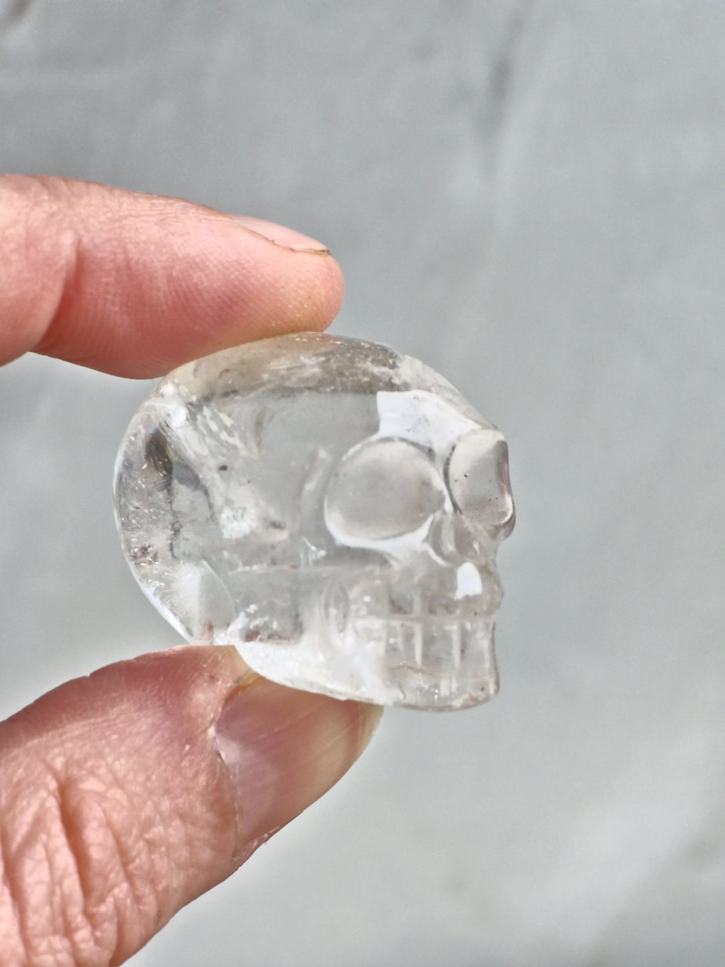 Clear quartz skull with rainbow - c