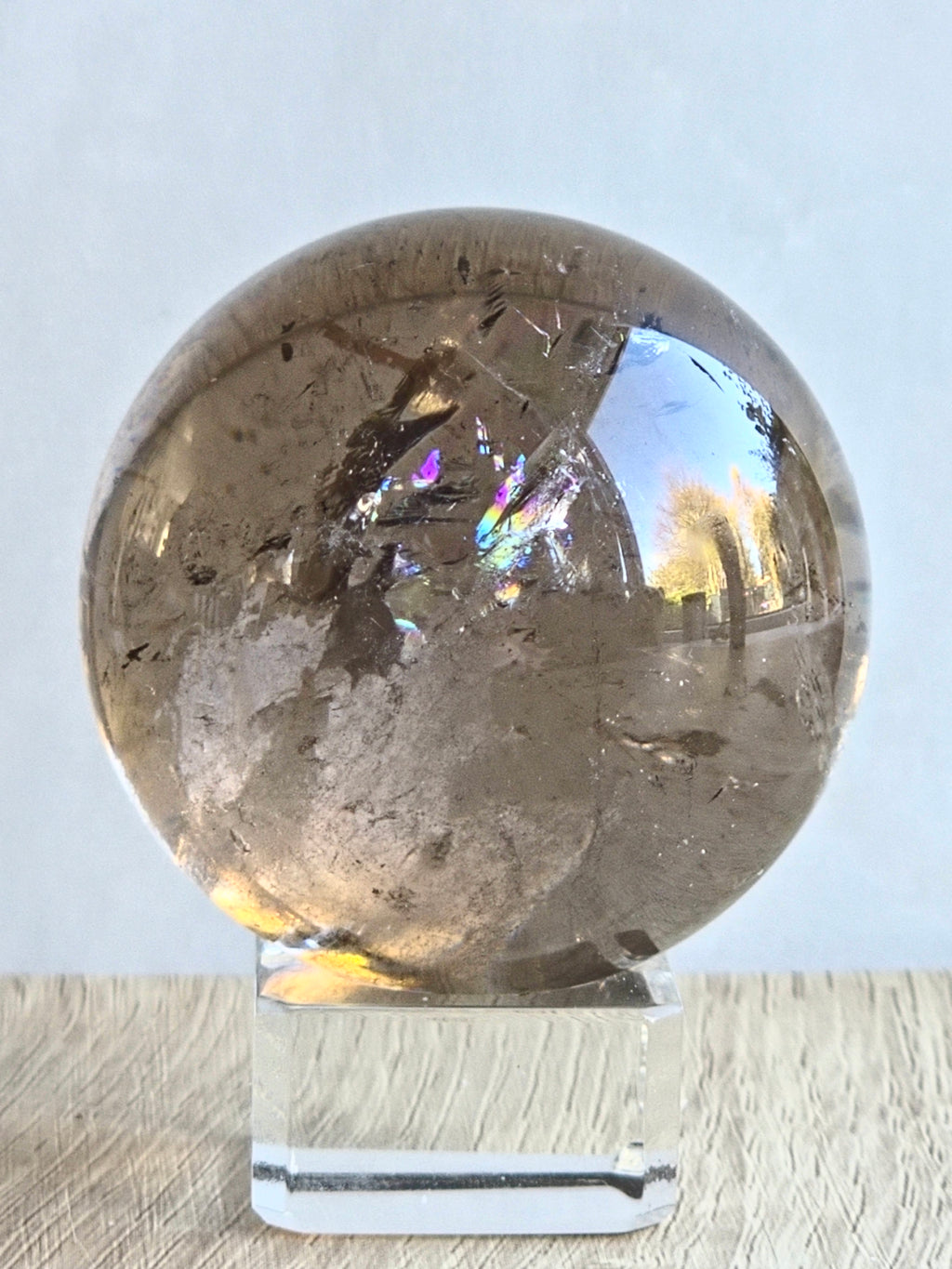 Smoky quartz sphere with rainbows - c