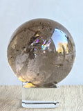 Smoky quartz sphere with rainbows - c