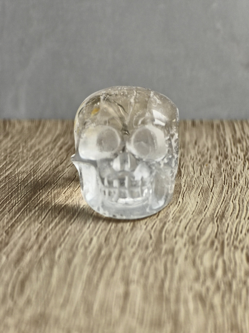 Clear quartz skull with iron inclusions