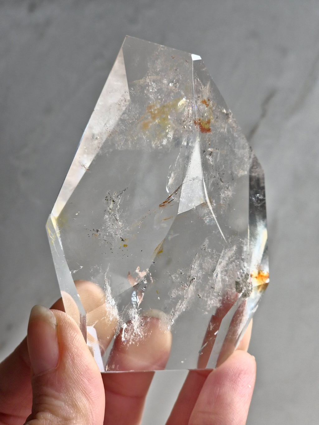 Quartz freeform with iron and chlorite inclusions