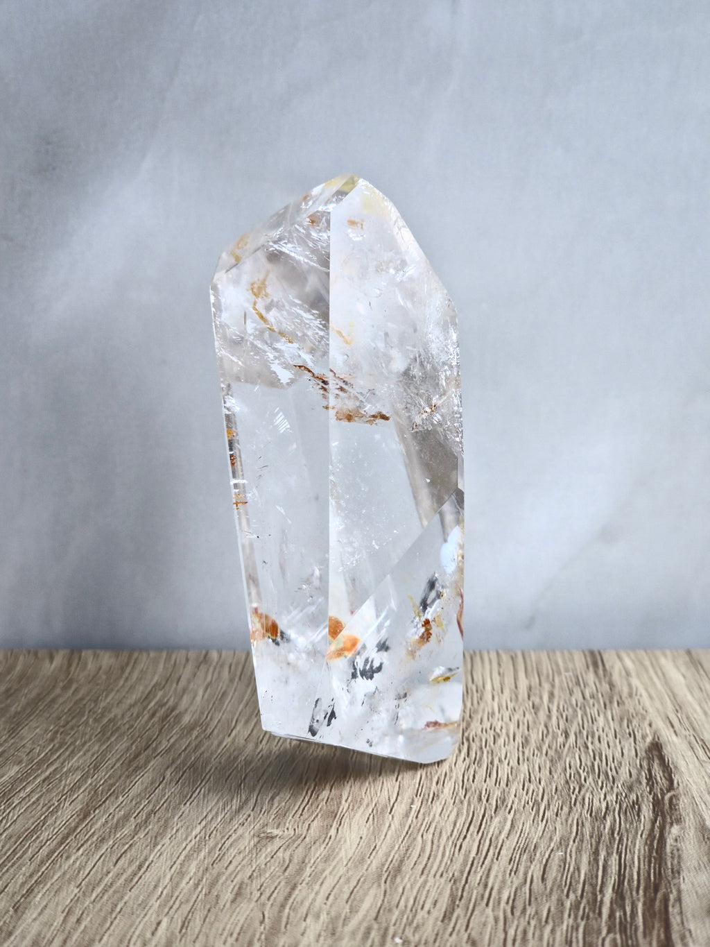 Quartz freeform with iron inclusions and rainbows