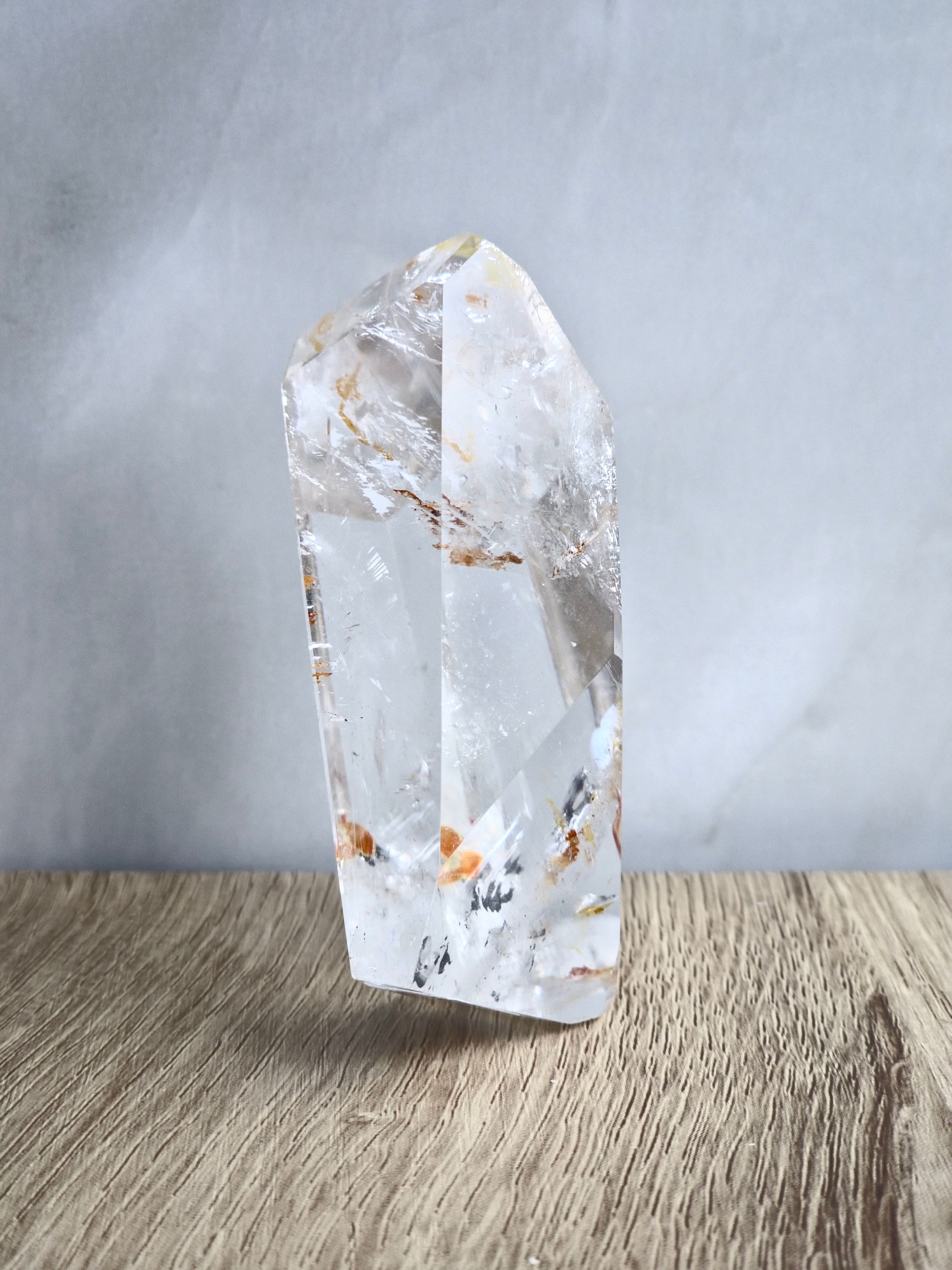 Quartz freeform with iron inclusions and rainbows