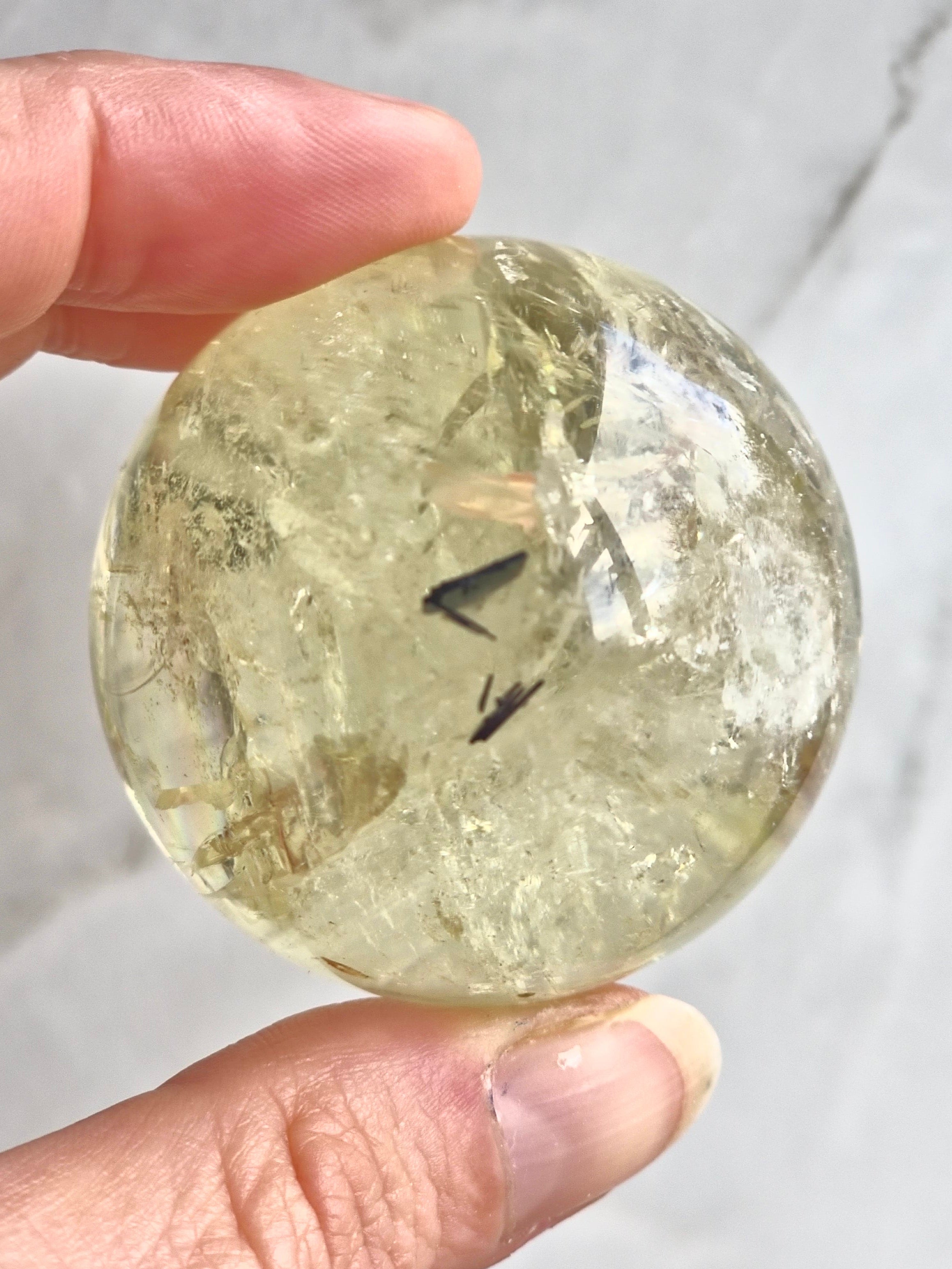 Citrine sphere with tourmaline inclusions