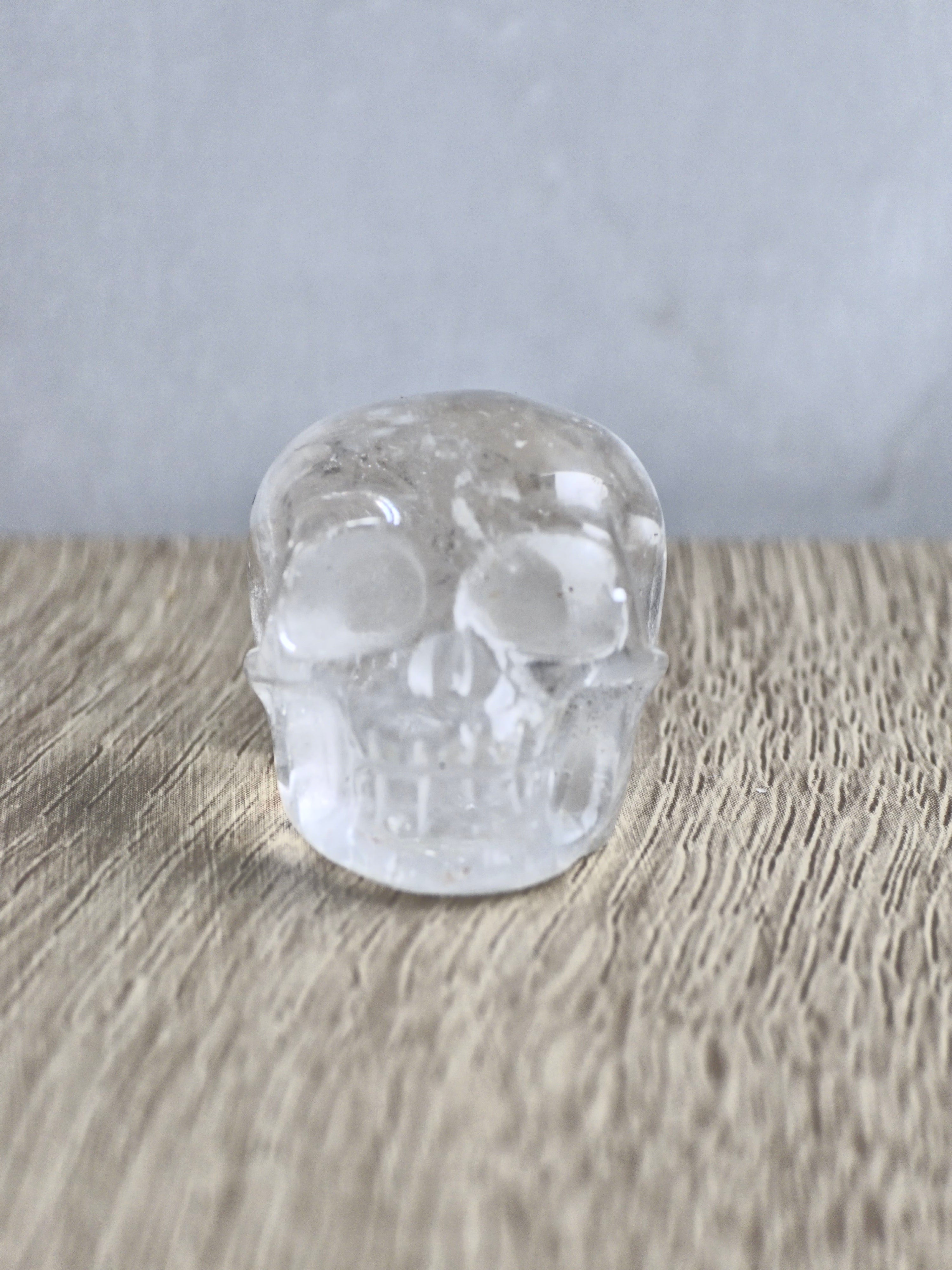 Clear quartz skull with rainbow - c