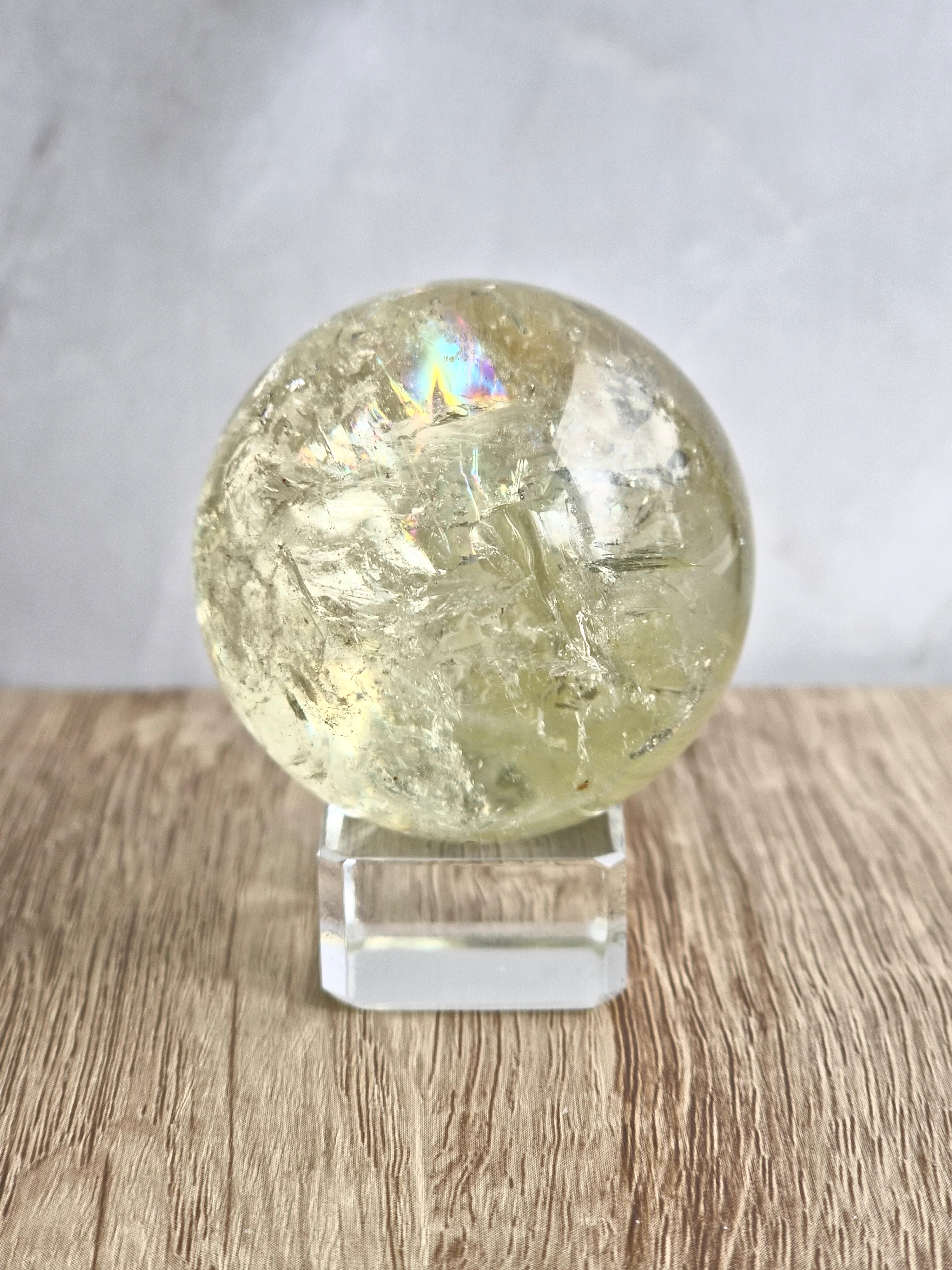 Citrine sphere with tourmaline inclusions