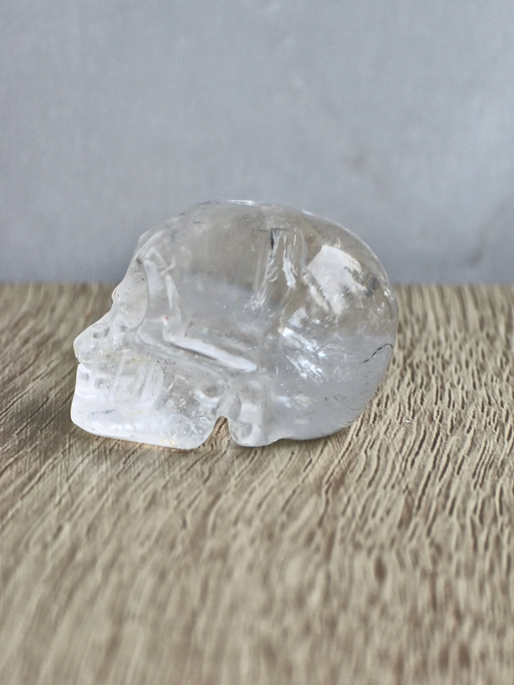 Clear quartz skull with rainbow - c
