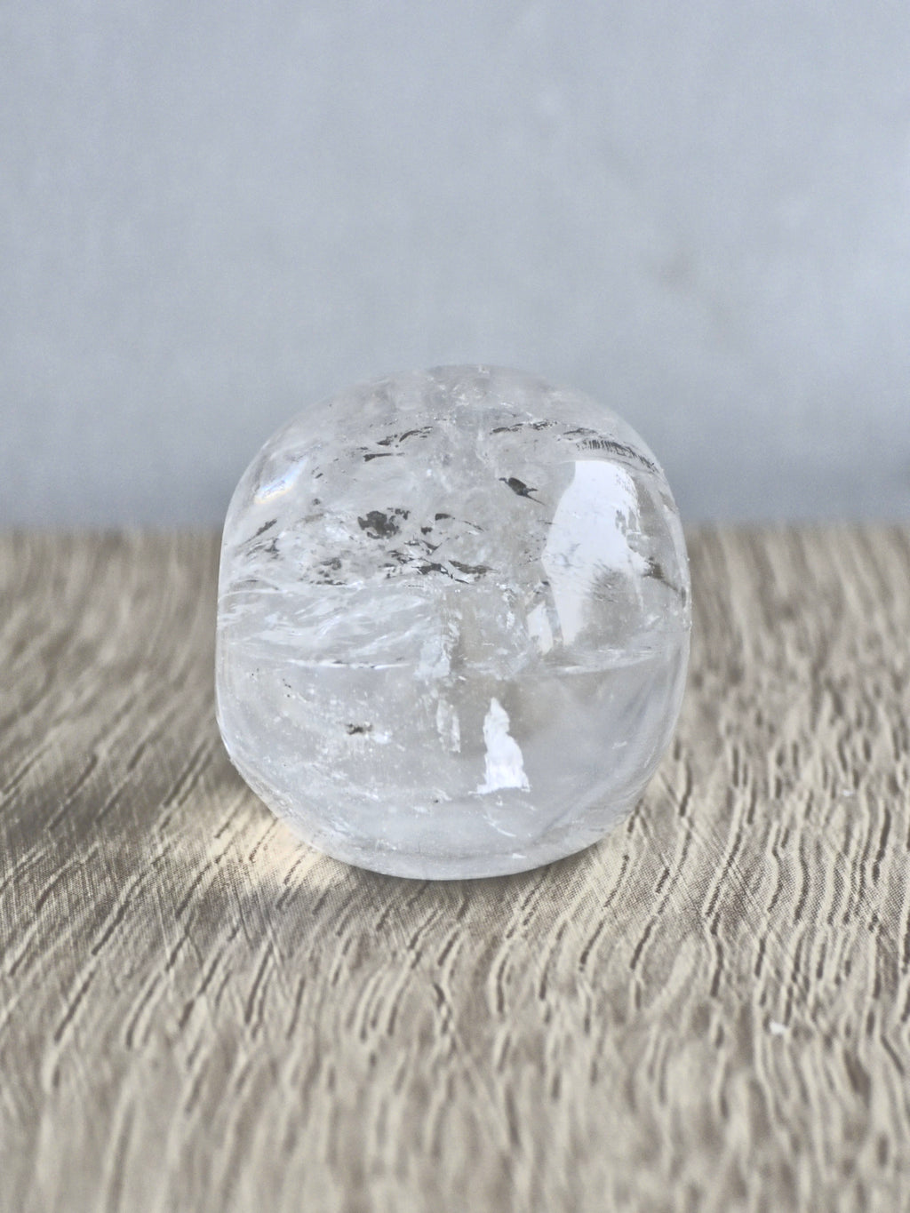 Clear quartz skull with rainbows - b