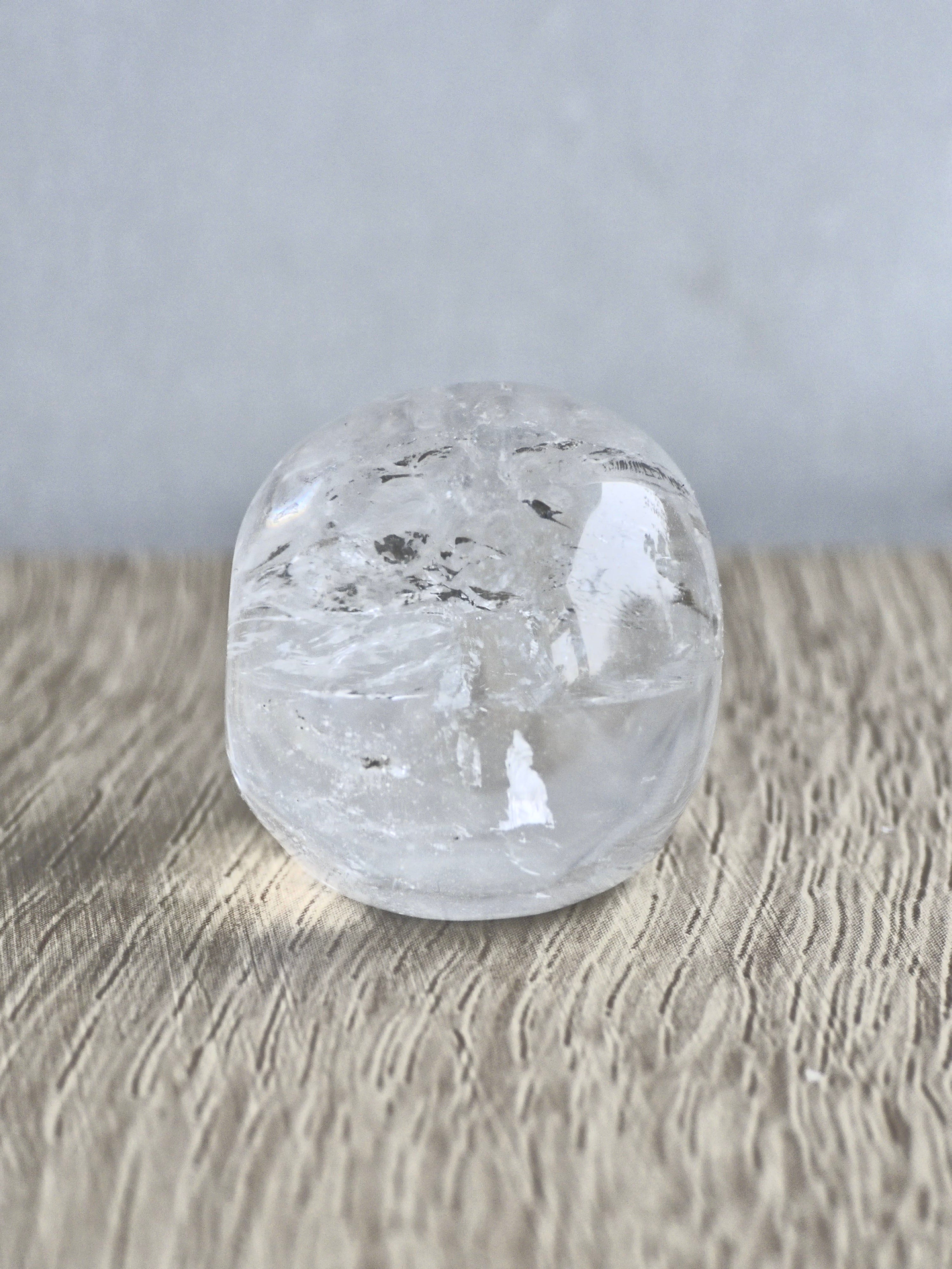 Clear quartz skull with rainbows - b