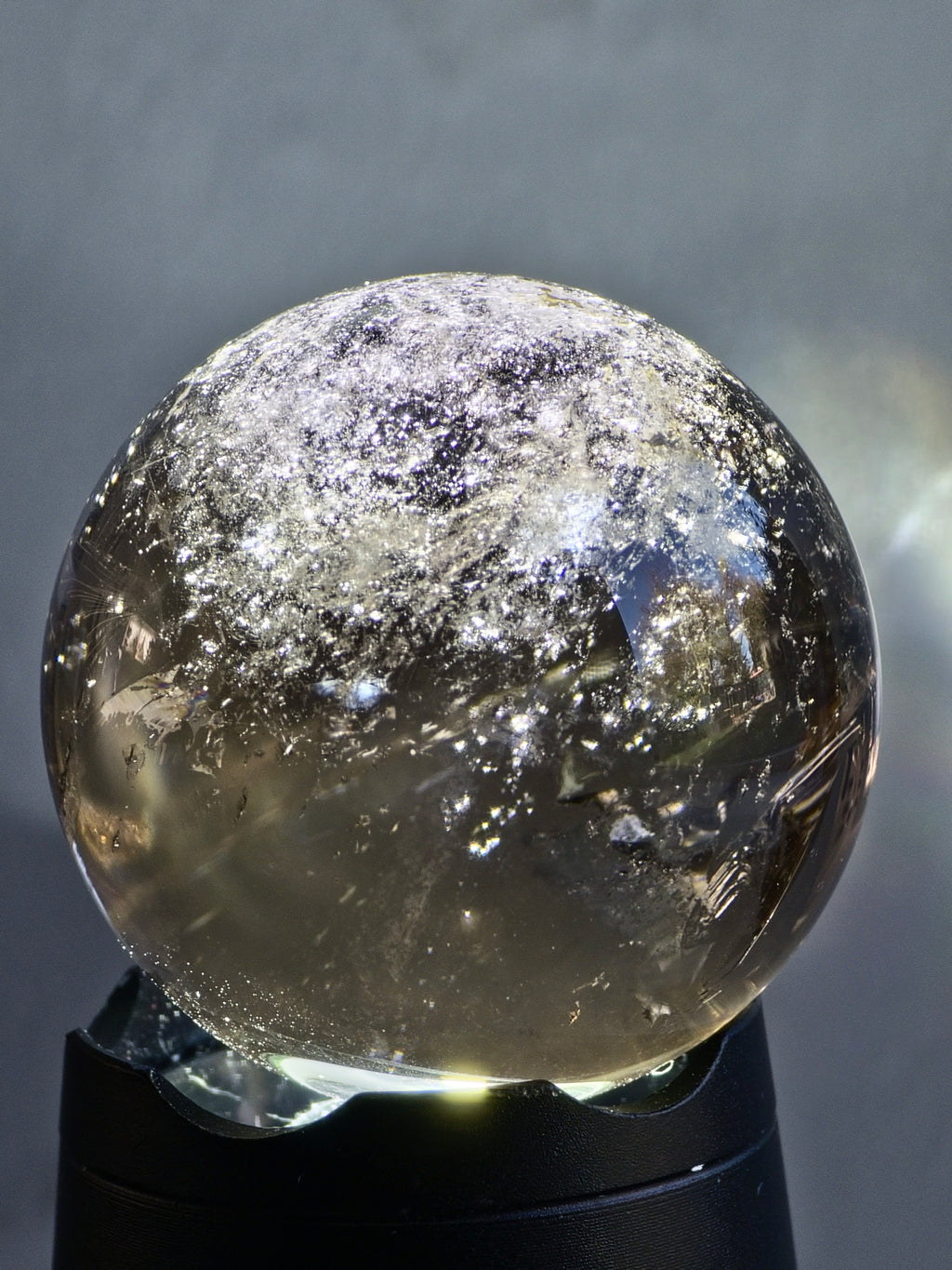 Smokey quartz sphere with rainbows - f