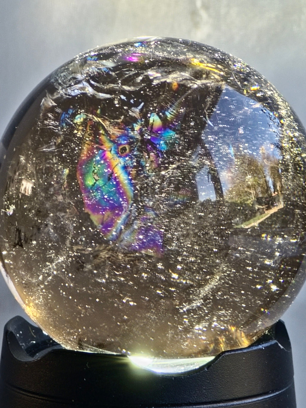 Smokey quartz sphere with rainbows- a
