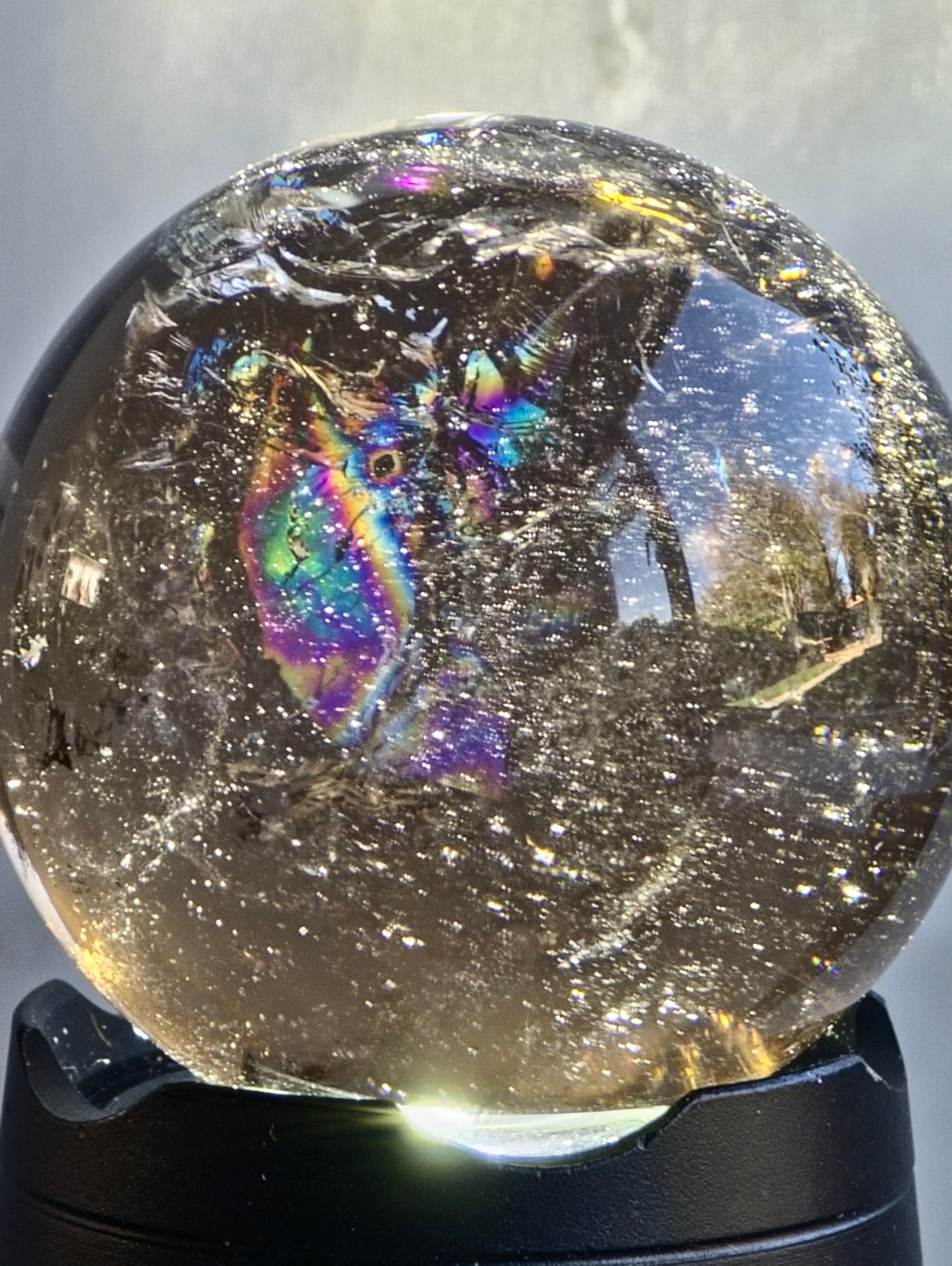 Smokey quartz sphere with rainbows- a