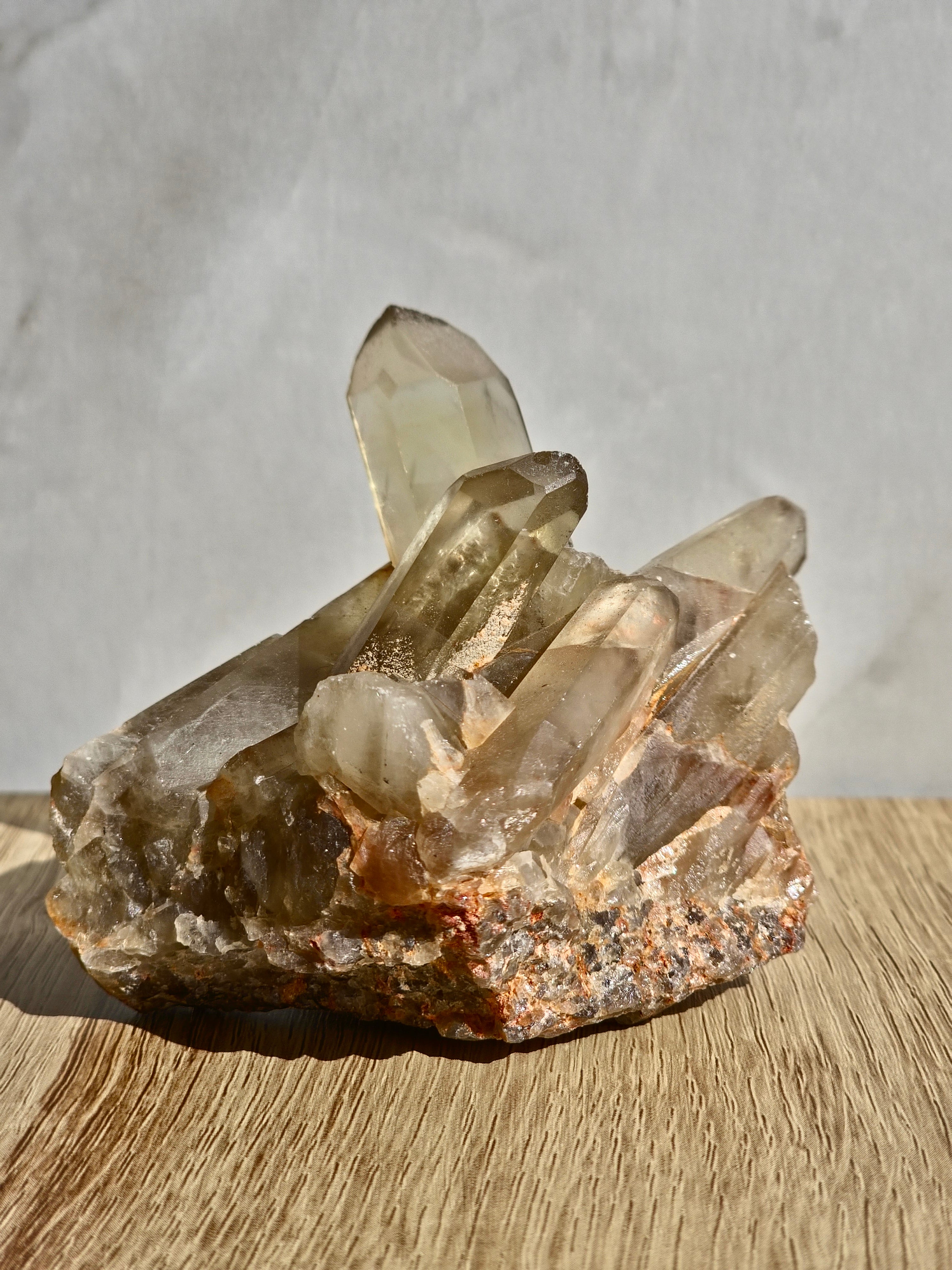 Natural citrine cluster with rainbow inclusion