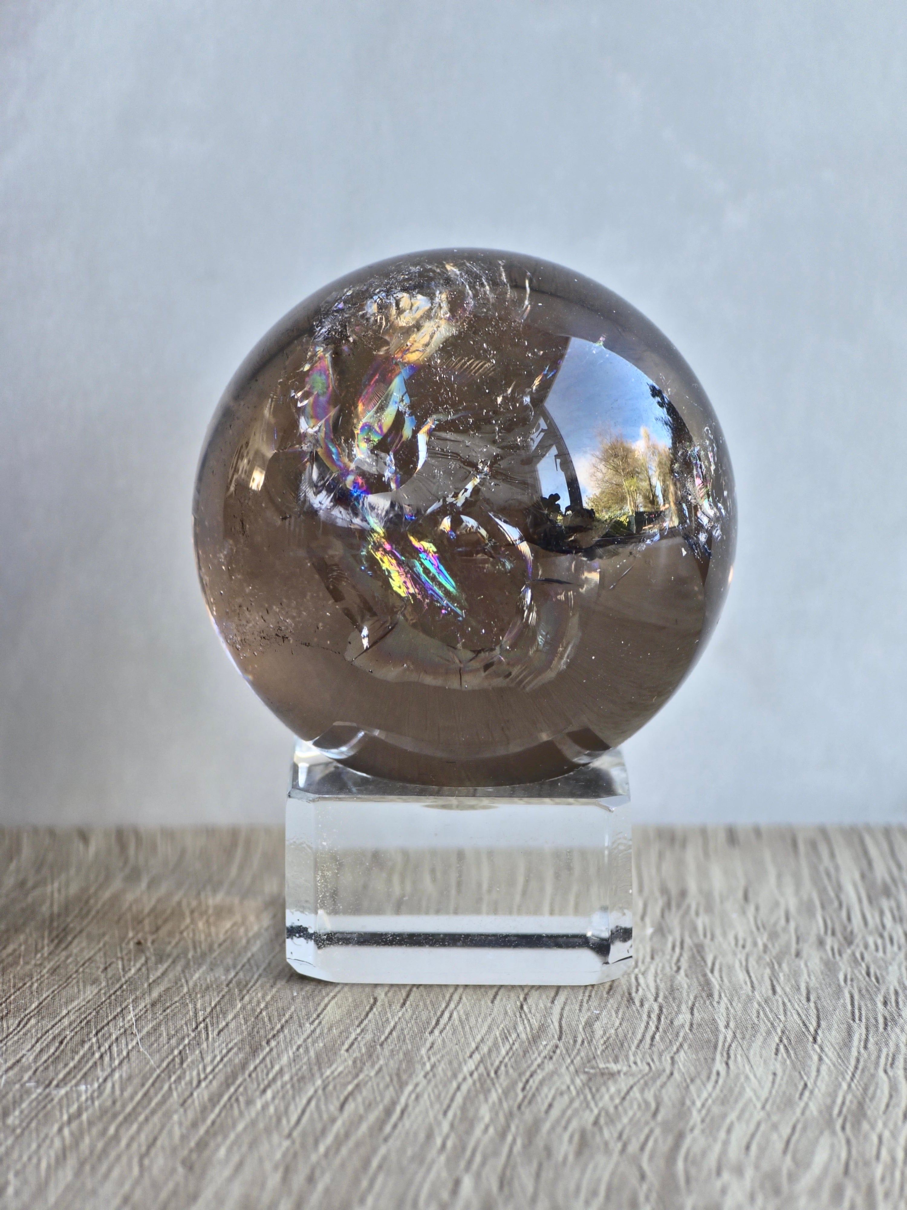 Smokey quartz sphere with rainbows- a