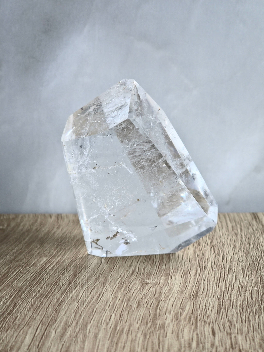 Quartz freeform with iron inclusions and rainbow