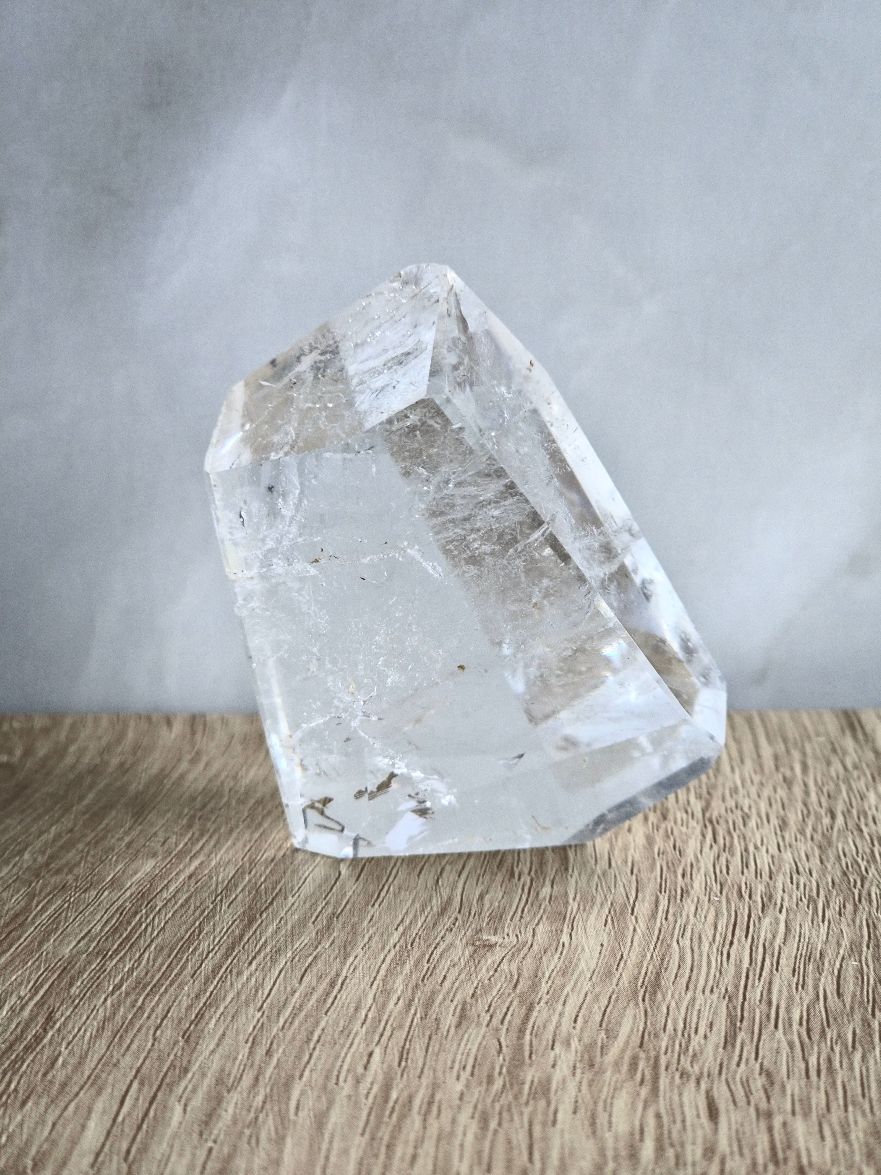 Quartz freeform with iron inclusions and rainbow