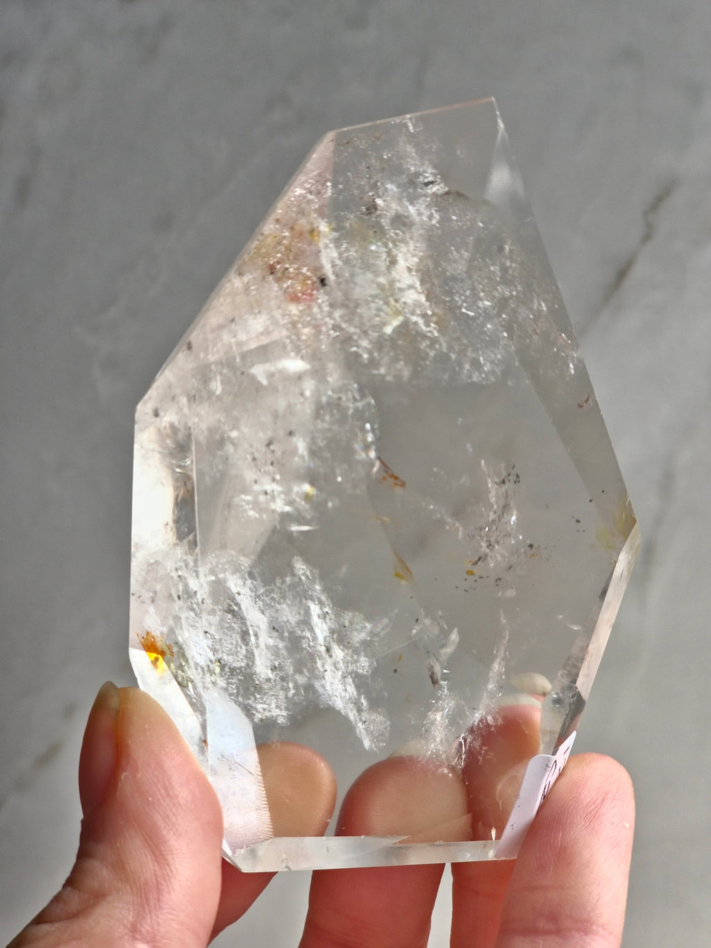 Quartz freeform with iron and chlorite inclusions