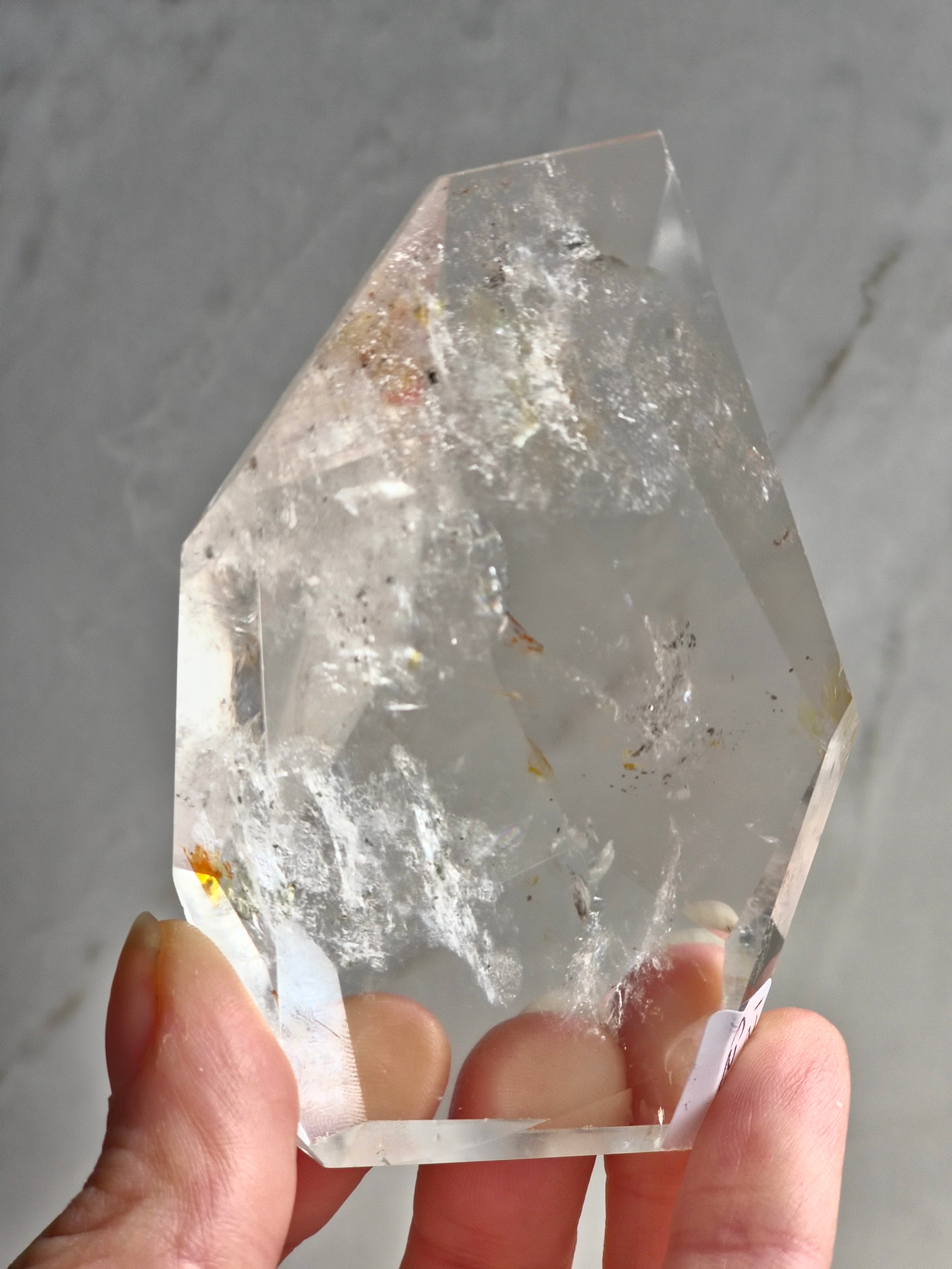 Quartz freeform with iron and chlorite inclusions